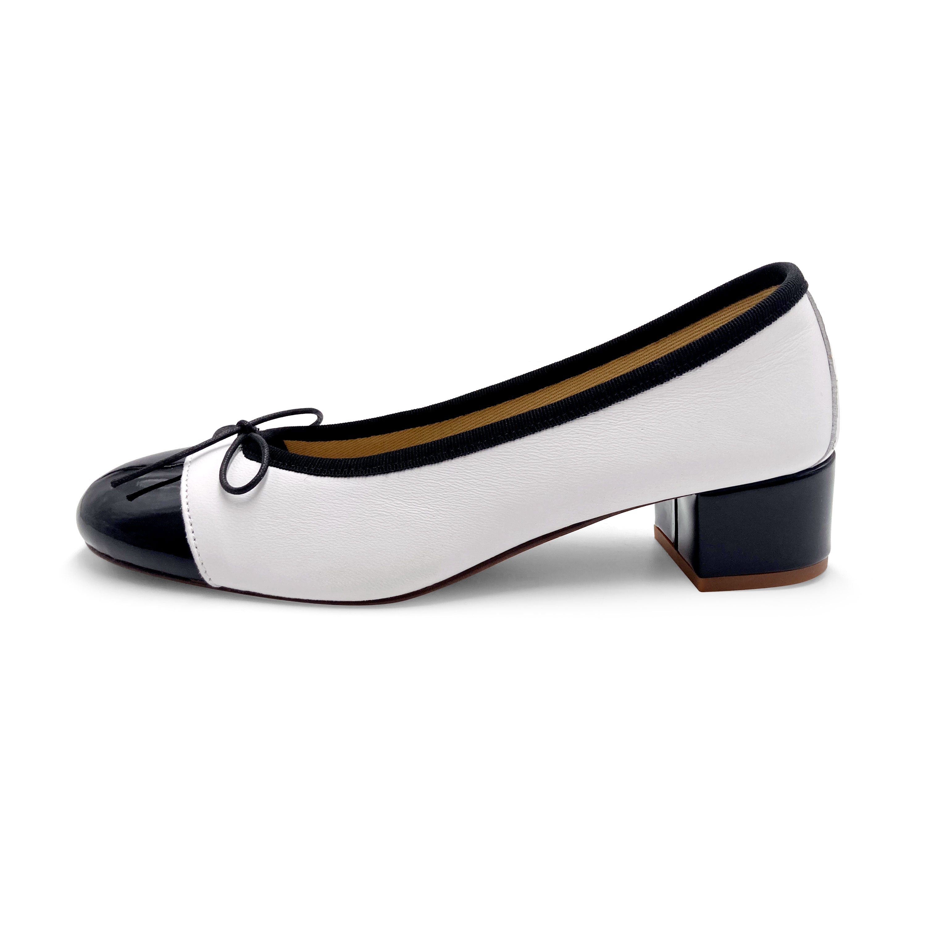 White leather ballet flats with high heel and patent toe