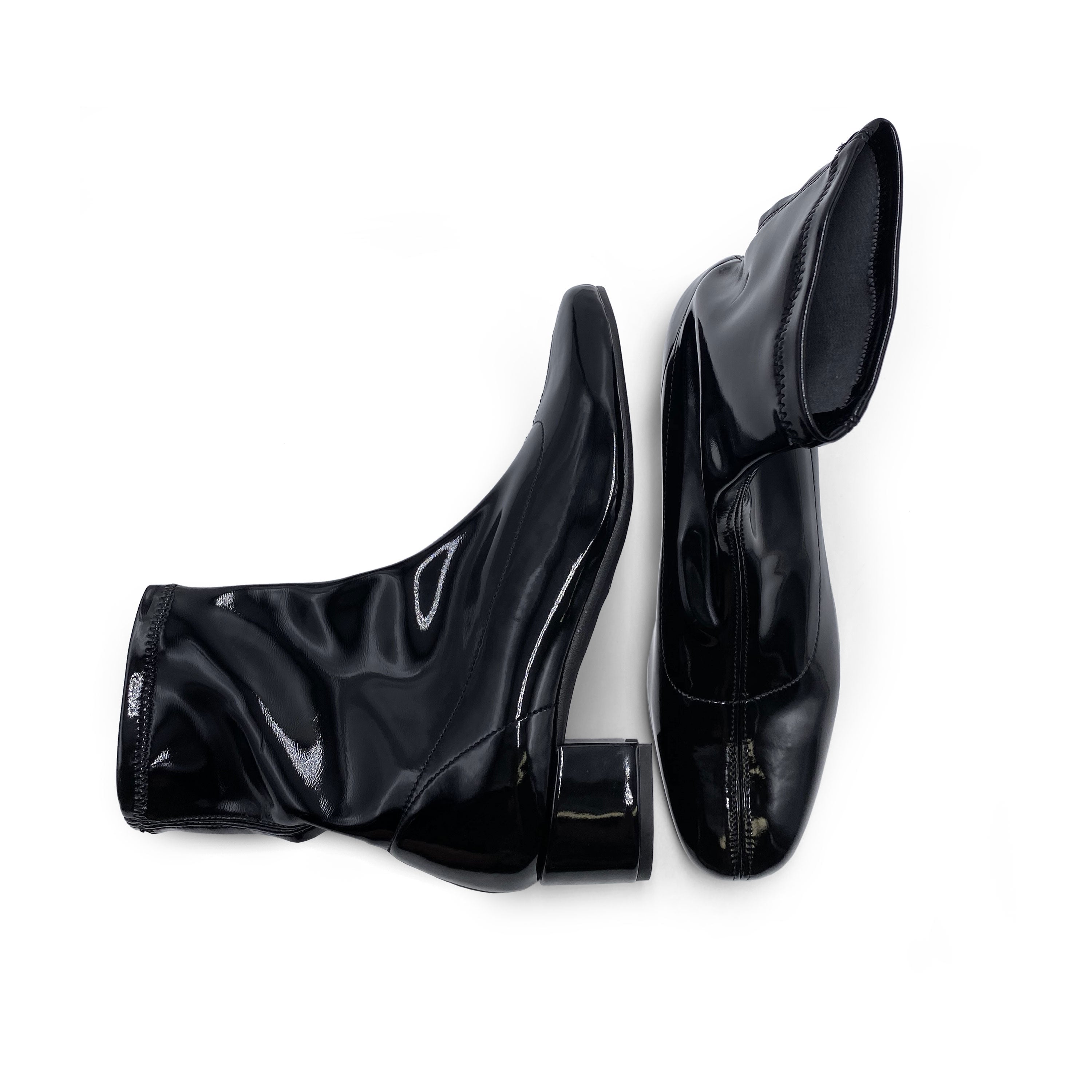 Black patent leather ankle boots with elasticated sock