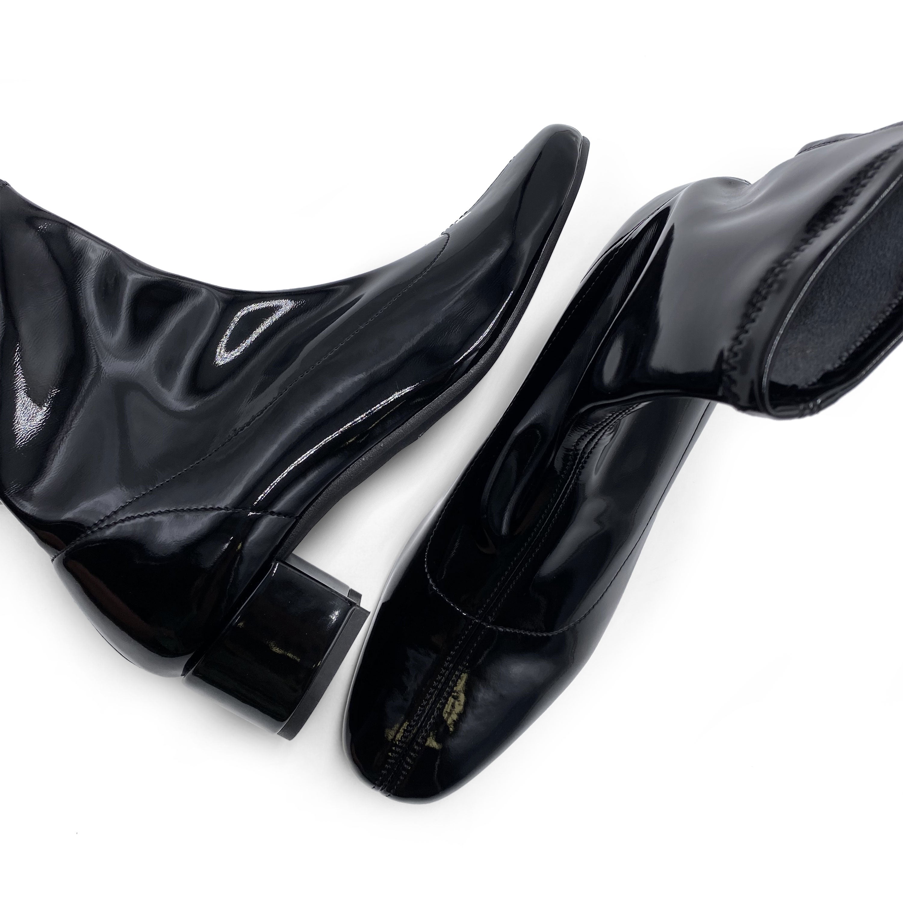 Black patent leather ankle boots with elasticated sock