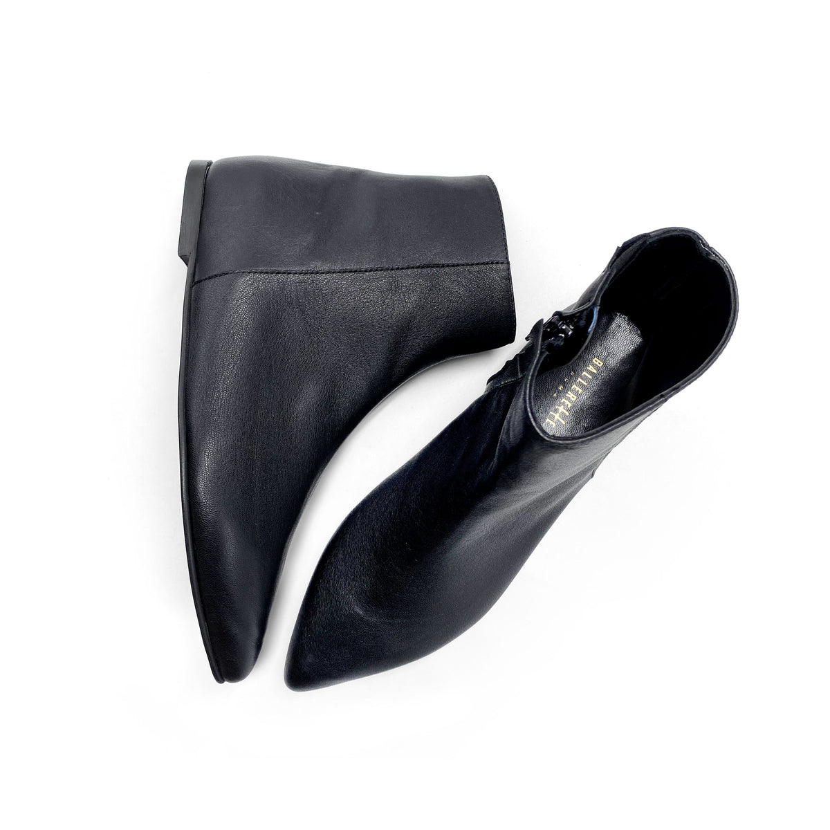 Black leather pointed-toe ankle boots with hidden internal platform