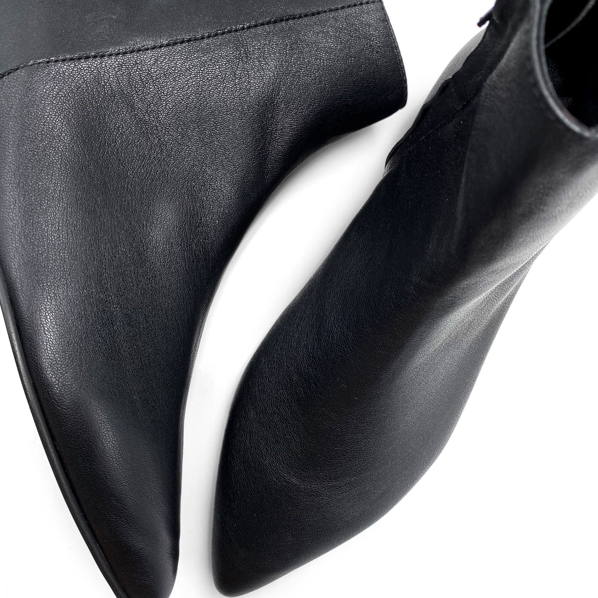 Black leather pointed-toe ankle boots with hidden internal platform
