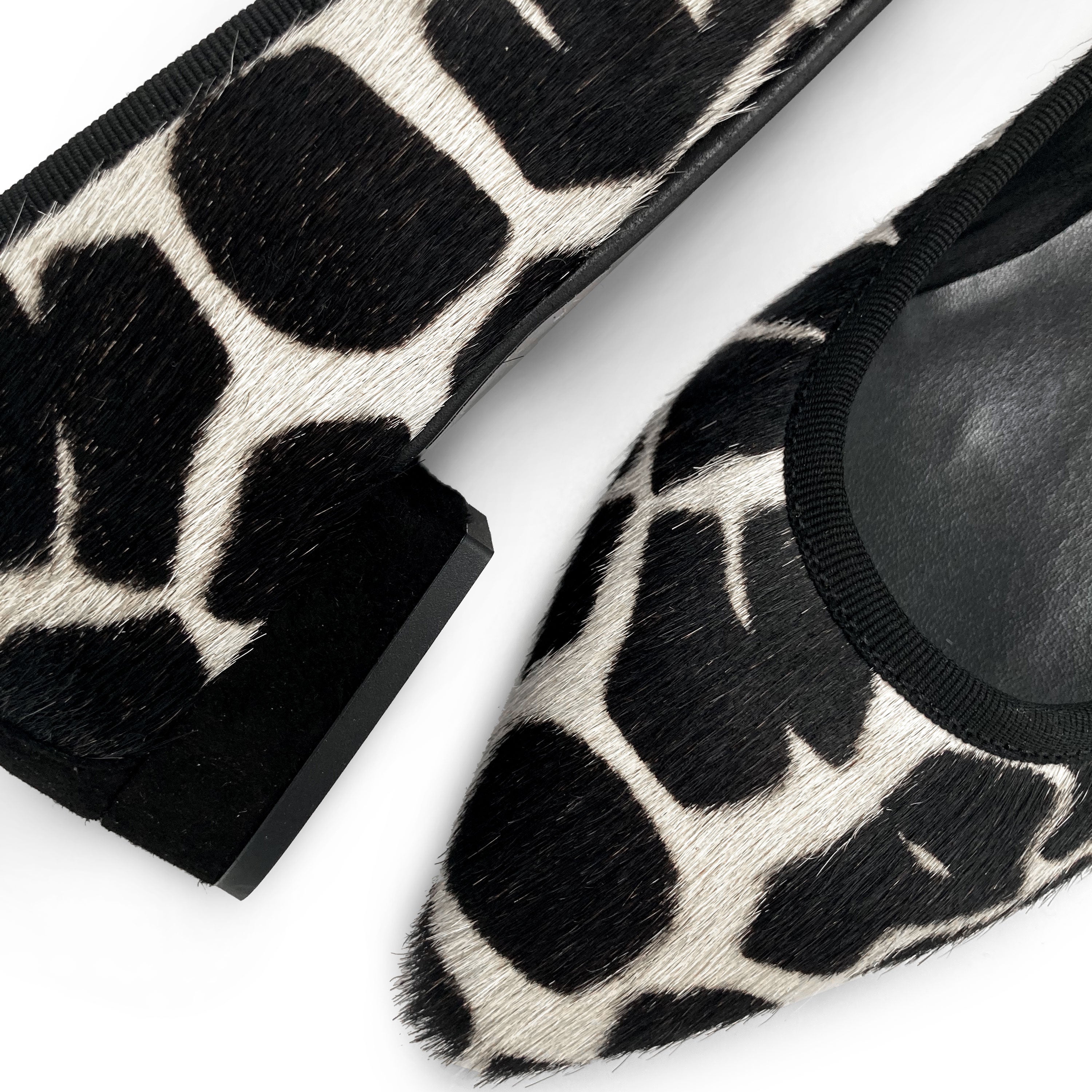 Black and white animal print pointed ballet flats