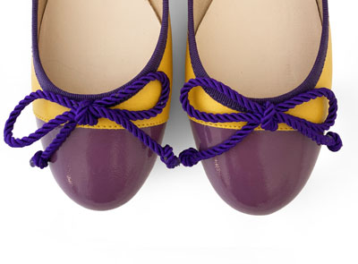 Yellow leather ballet flats with purple toe and bow