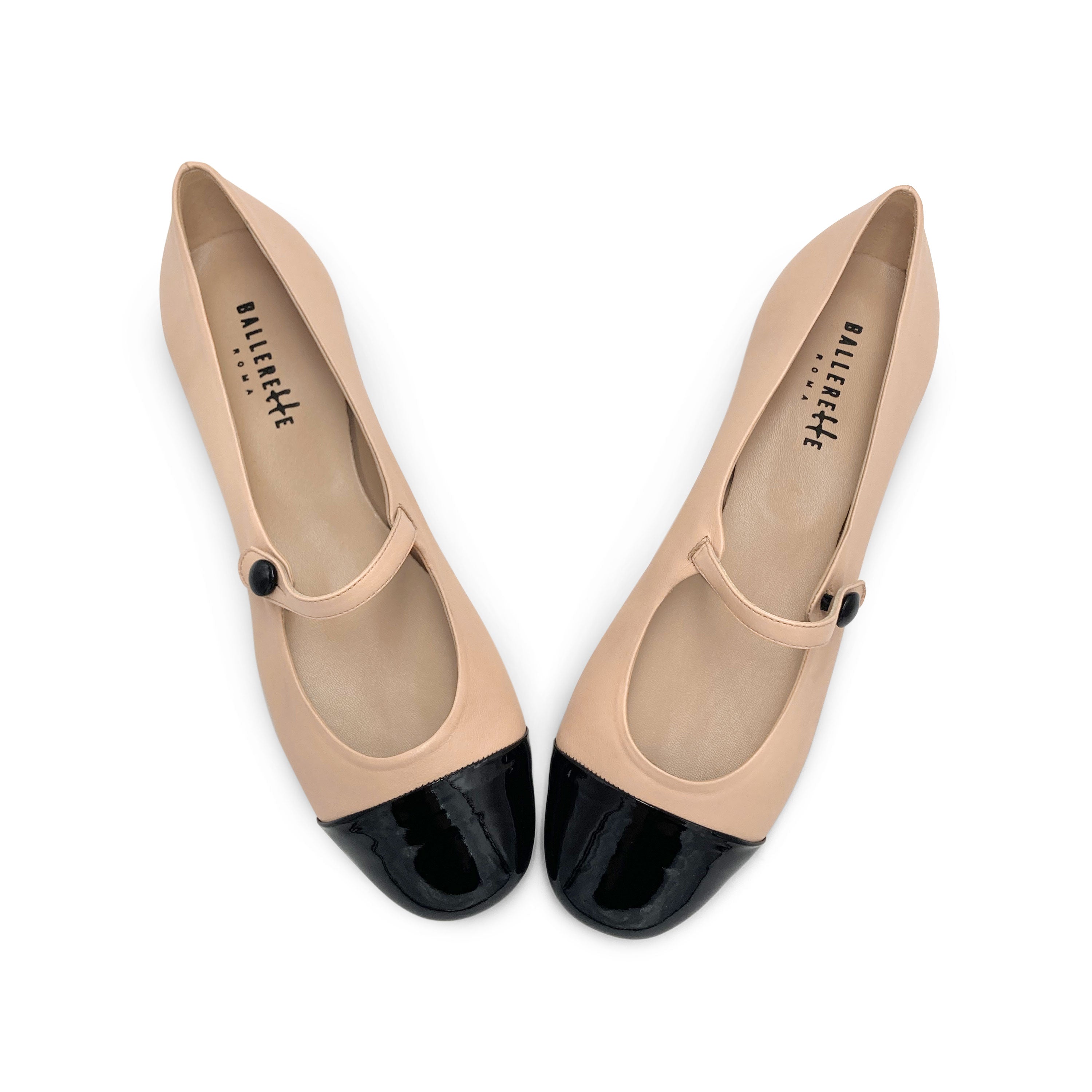 Powder pink ballet flats with black patent toe and strap