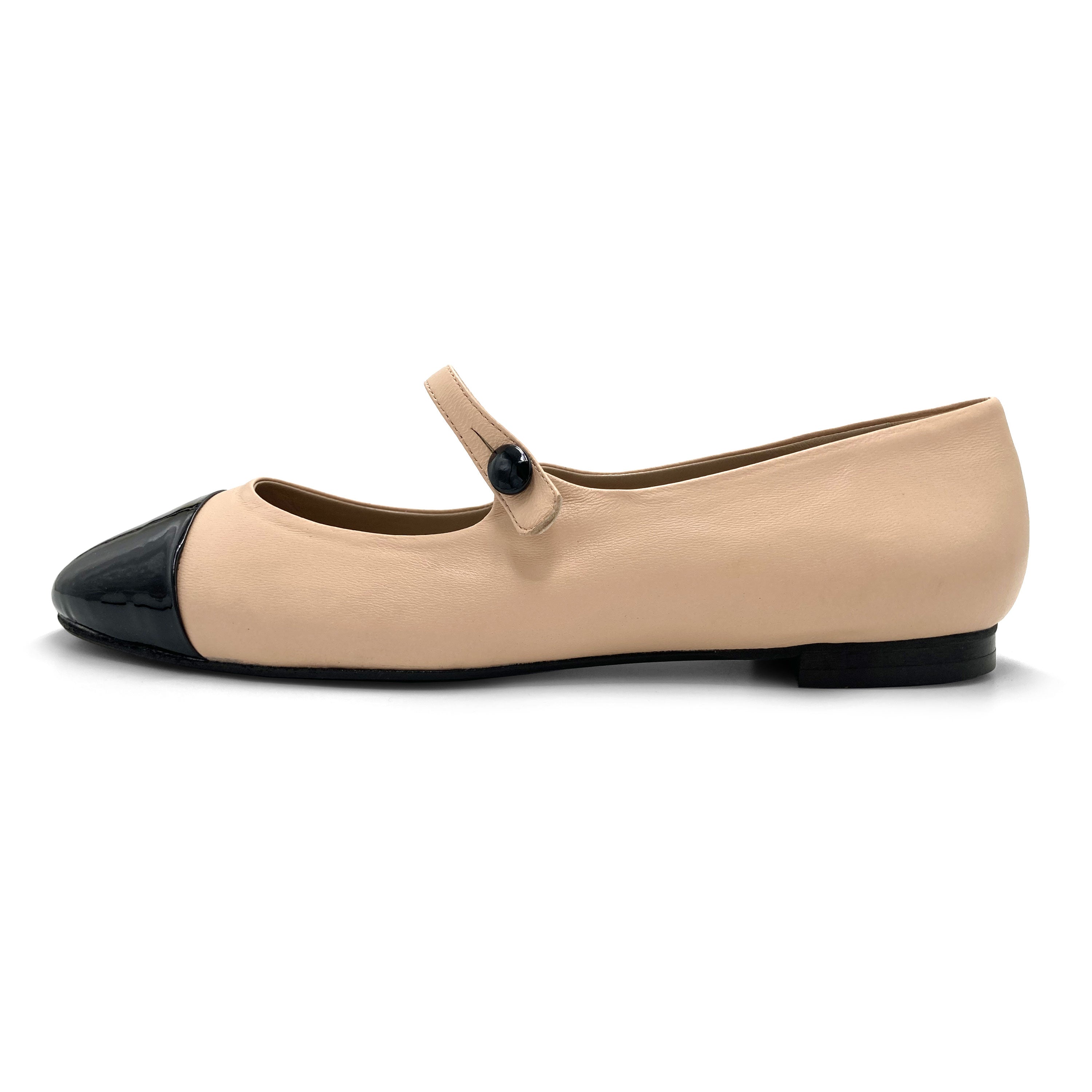 Powder pink ballet flats with black patent toe and strap