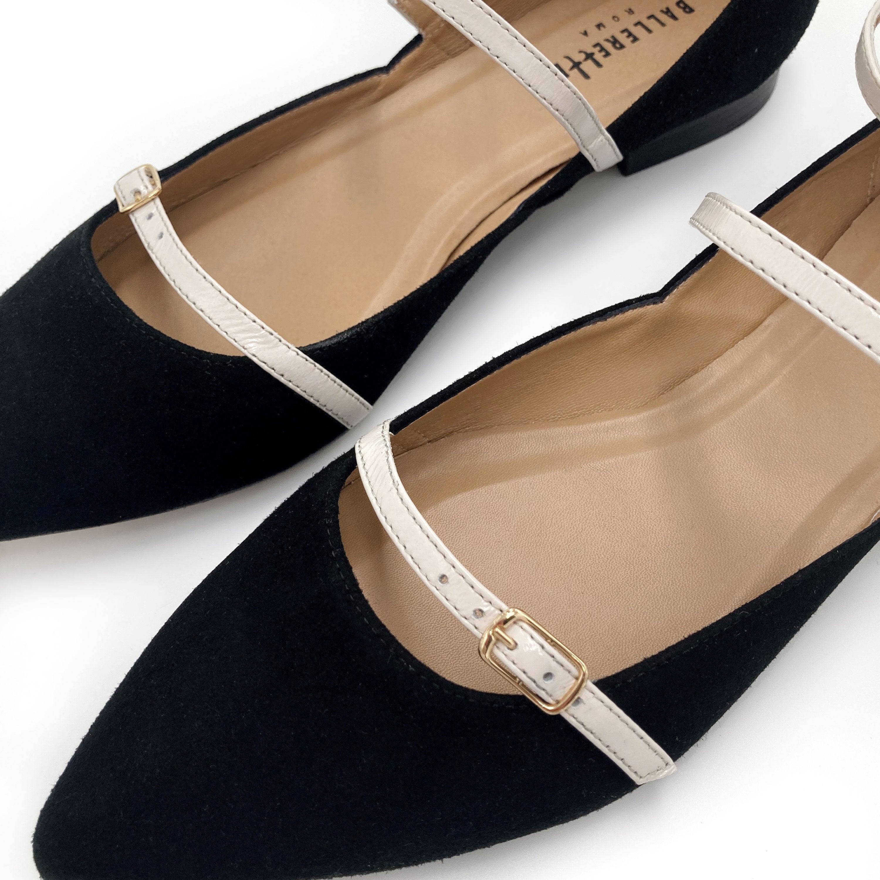 Black suede ballet flats with cream straps