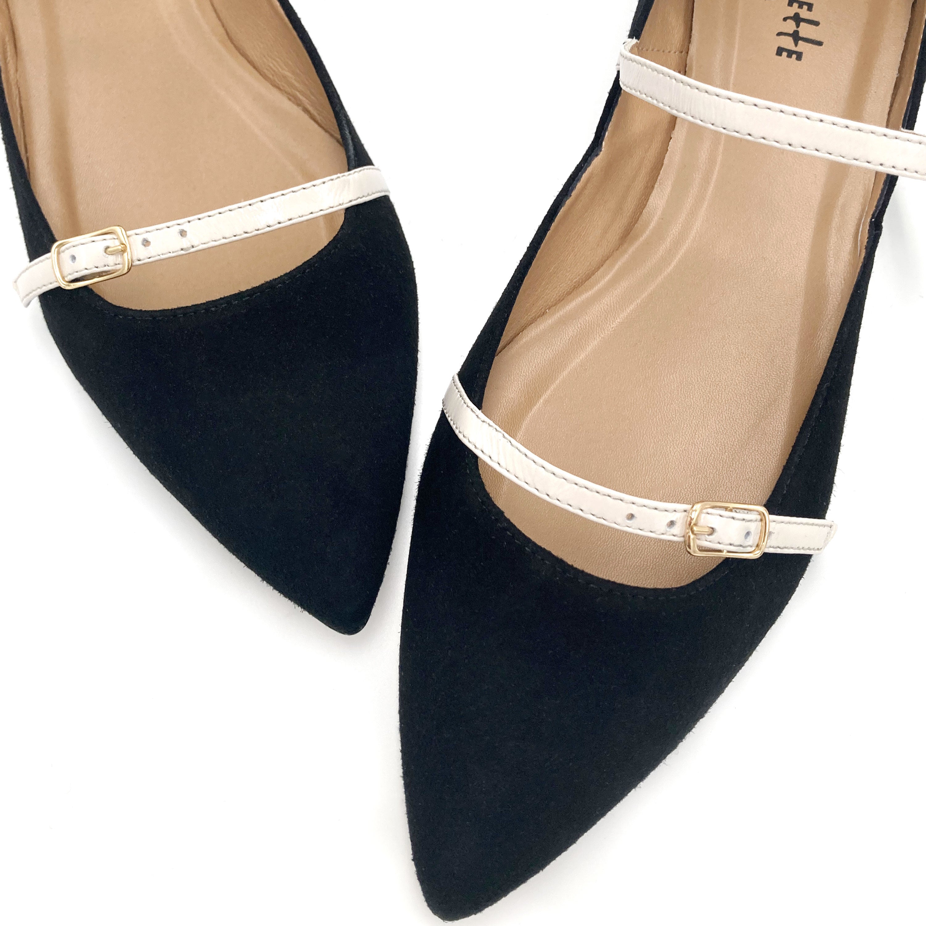 Black suede ballet flats with cream straps