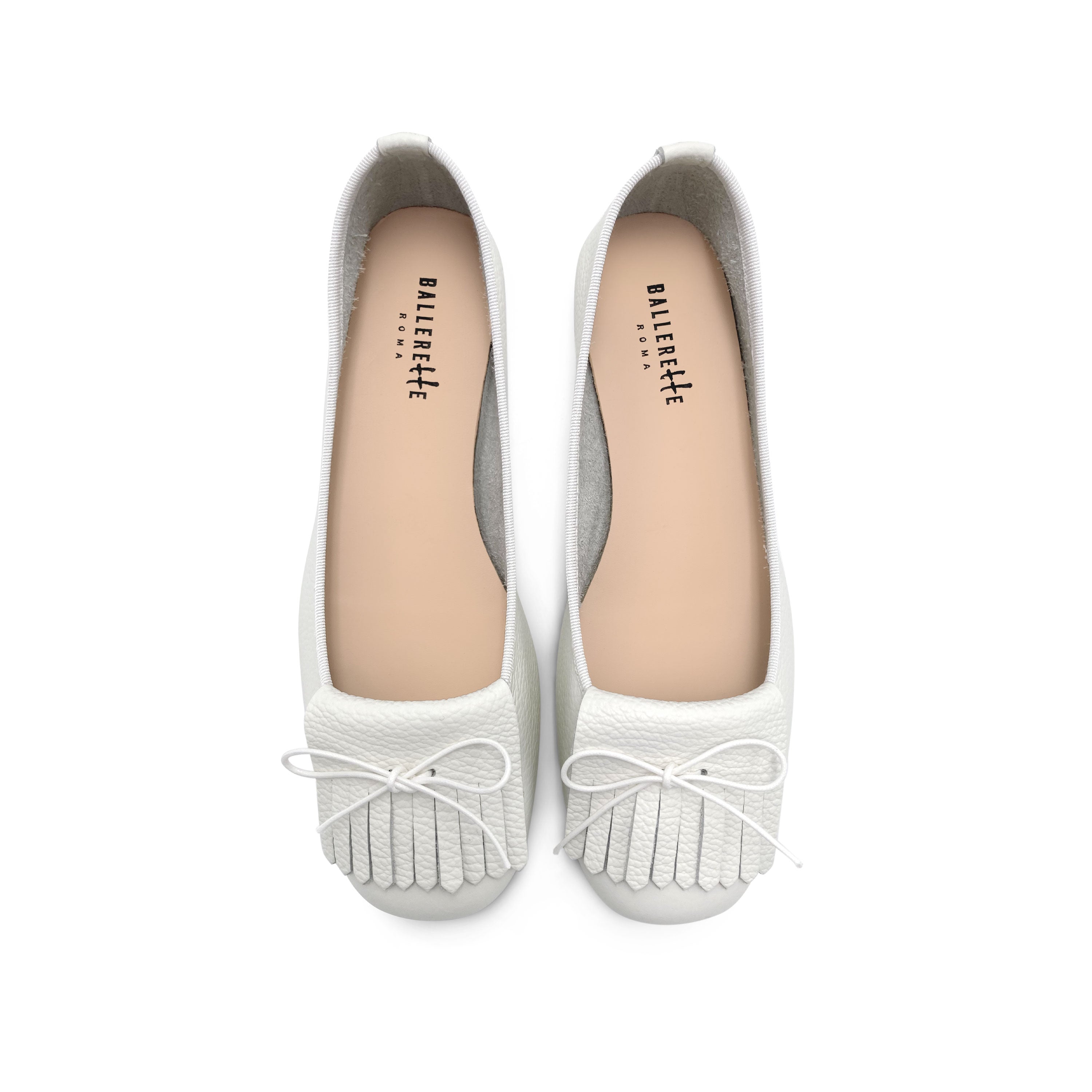 White leather moccasins with fringe