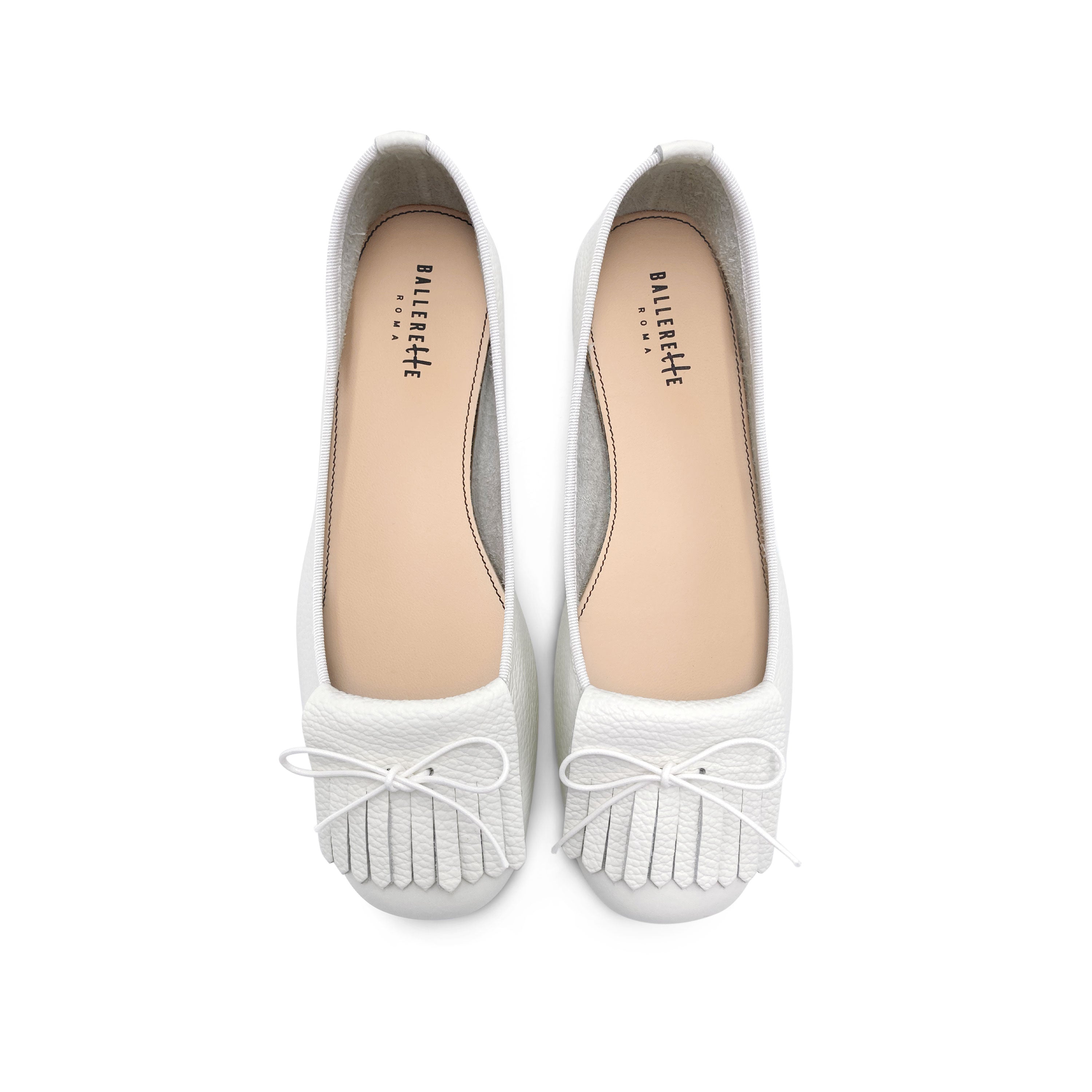 White leather moccasins with fringe