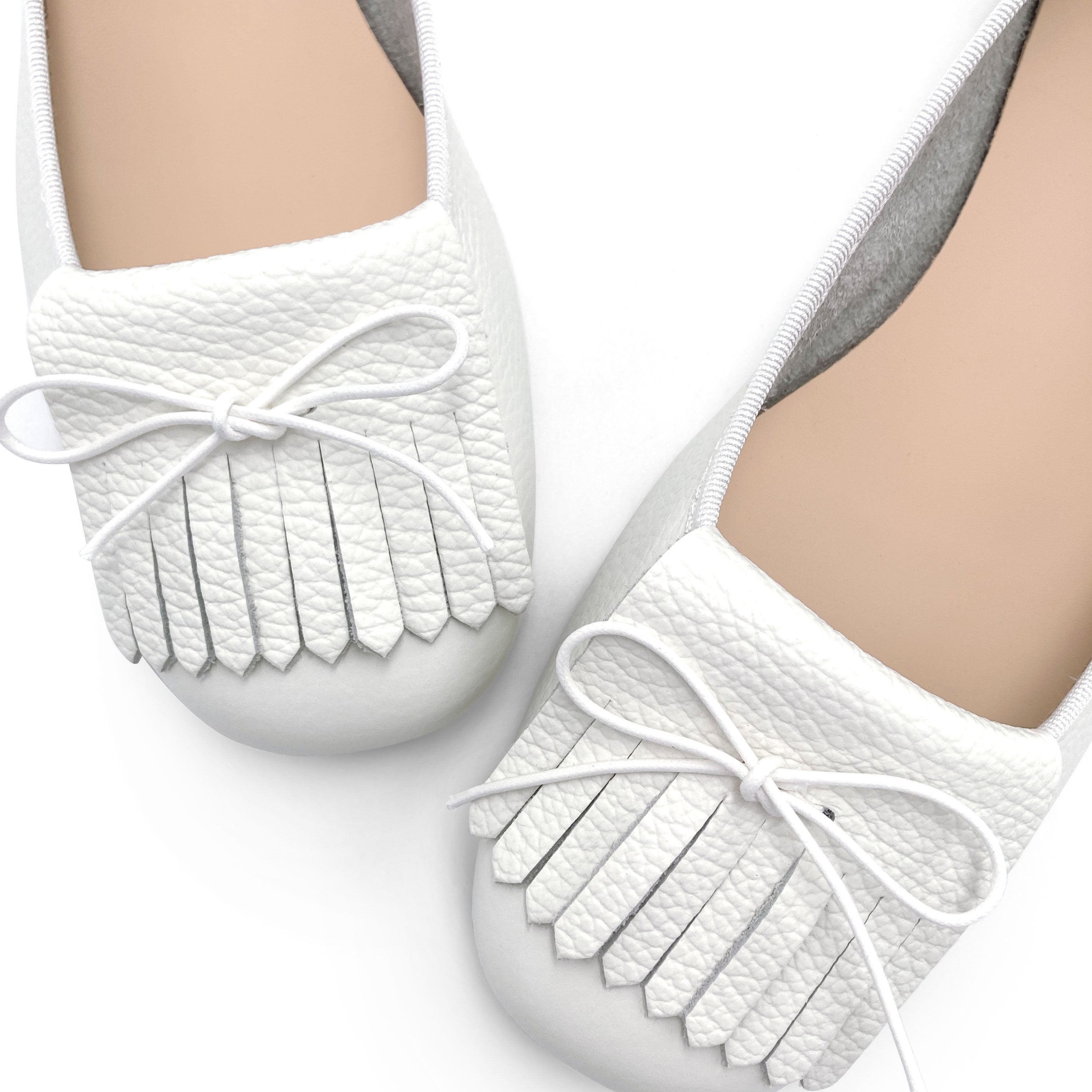 White leather moccasins with fringe