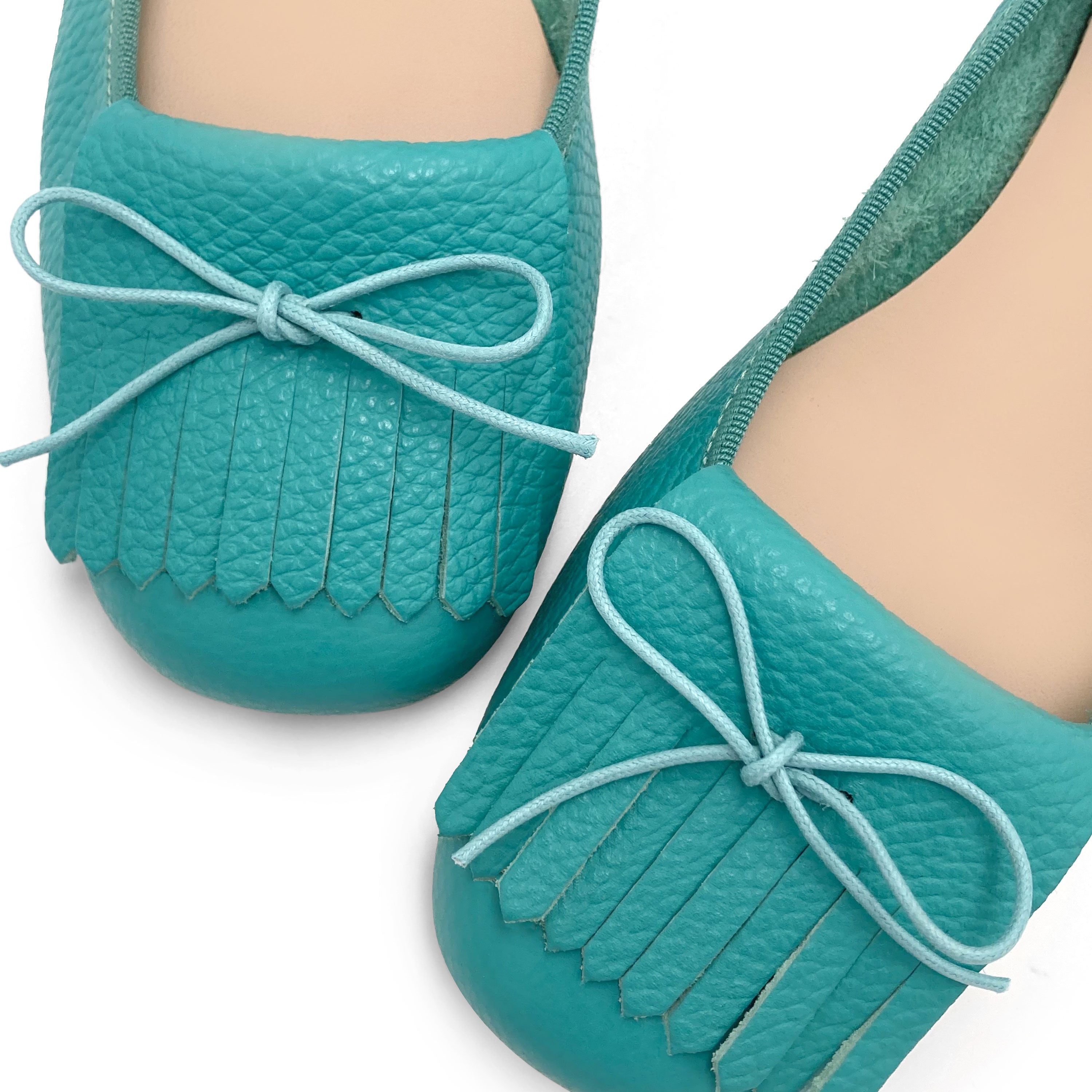 Women's aqua blue leather moccasins with fringes