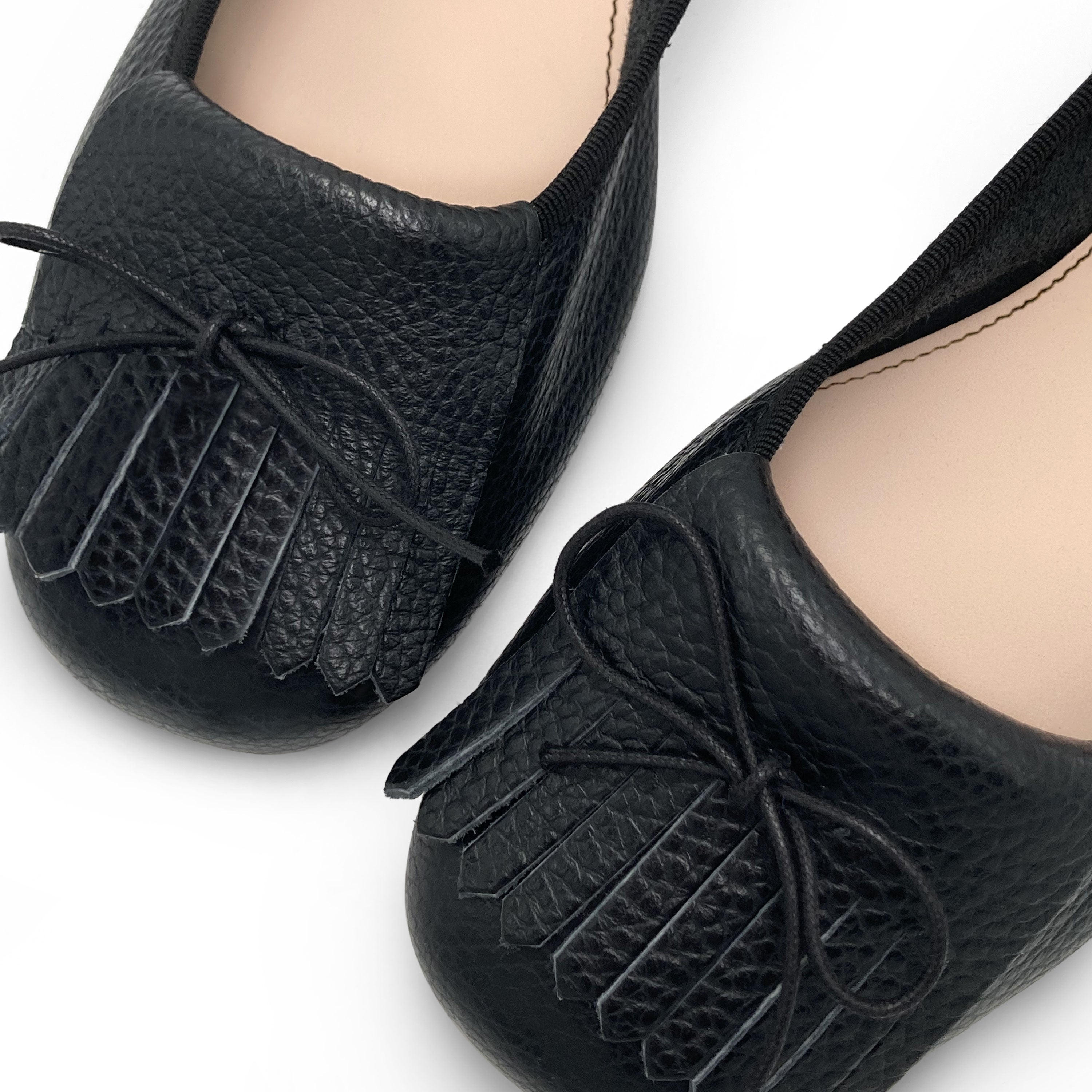 Black leather moccasins with fringe tassel