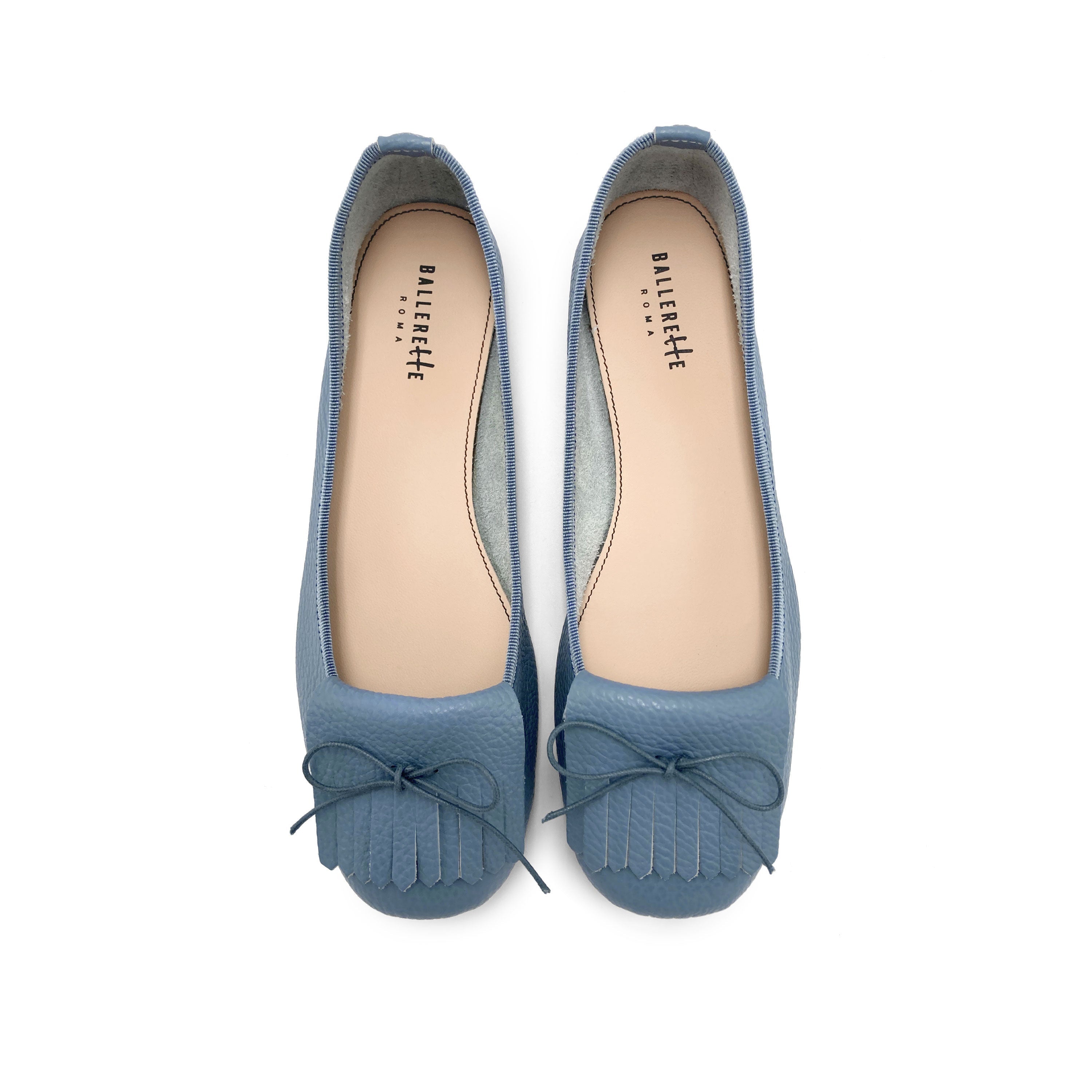 Denim-blue leather moccassins with fringes