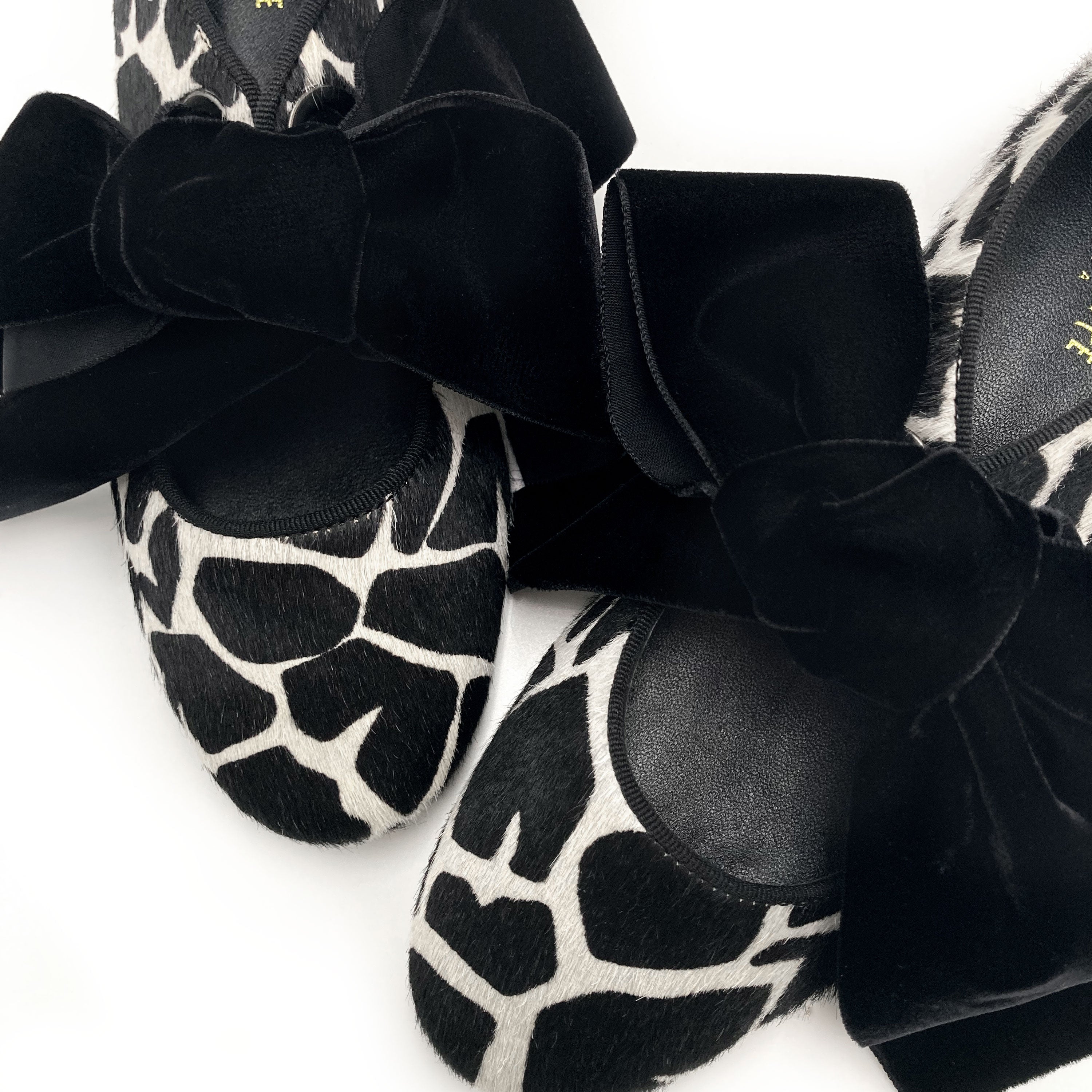 Women's black and white animal print moccasins