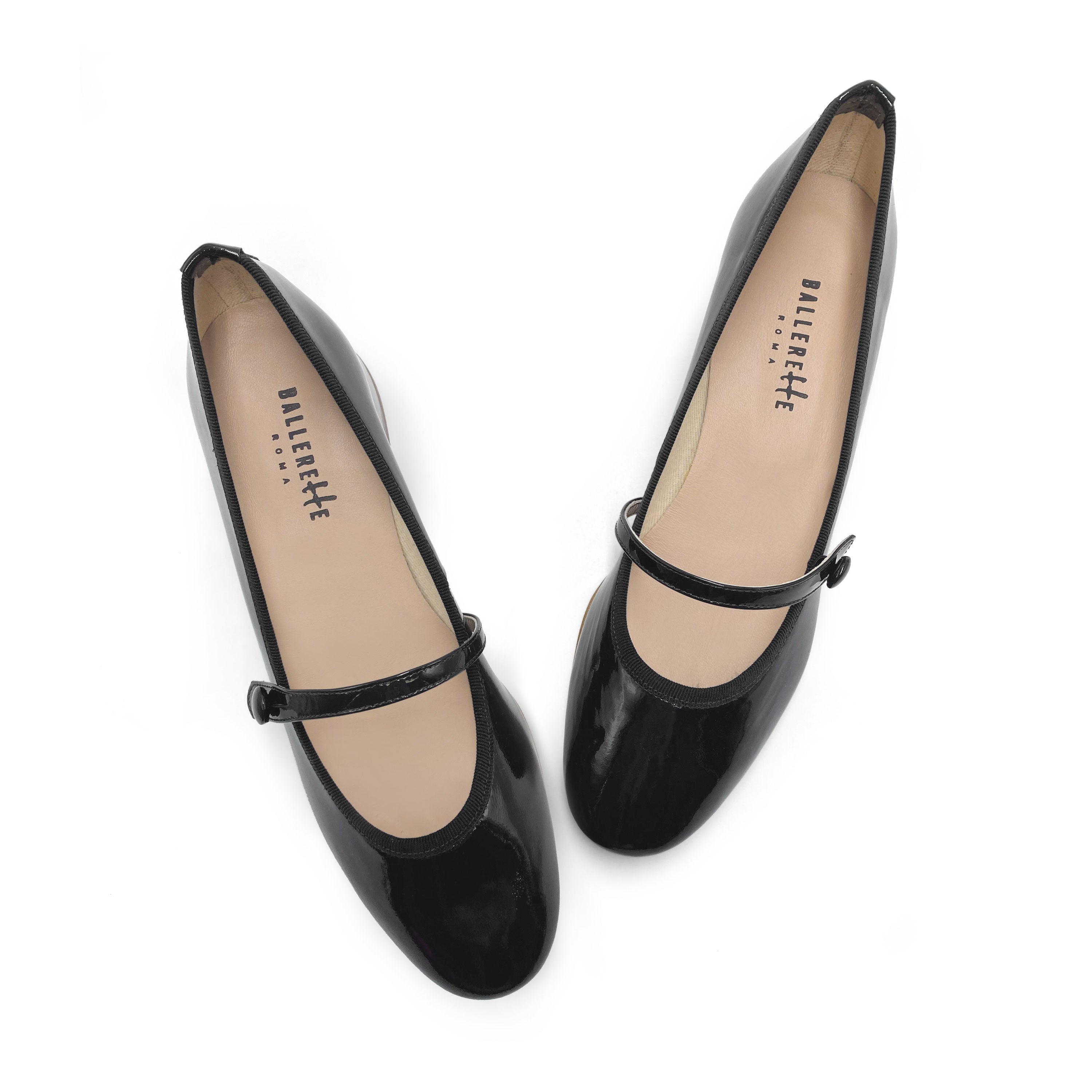 Black patent leather Mary Jane ballet flats with strap and heel