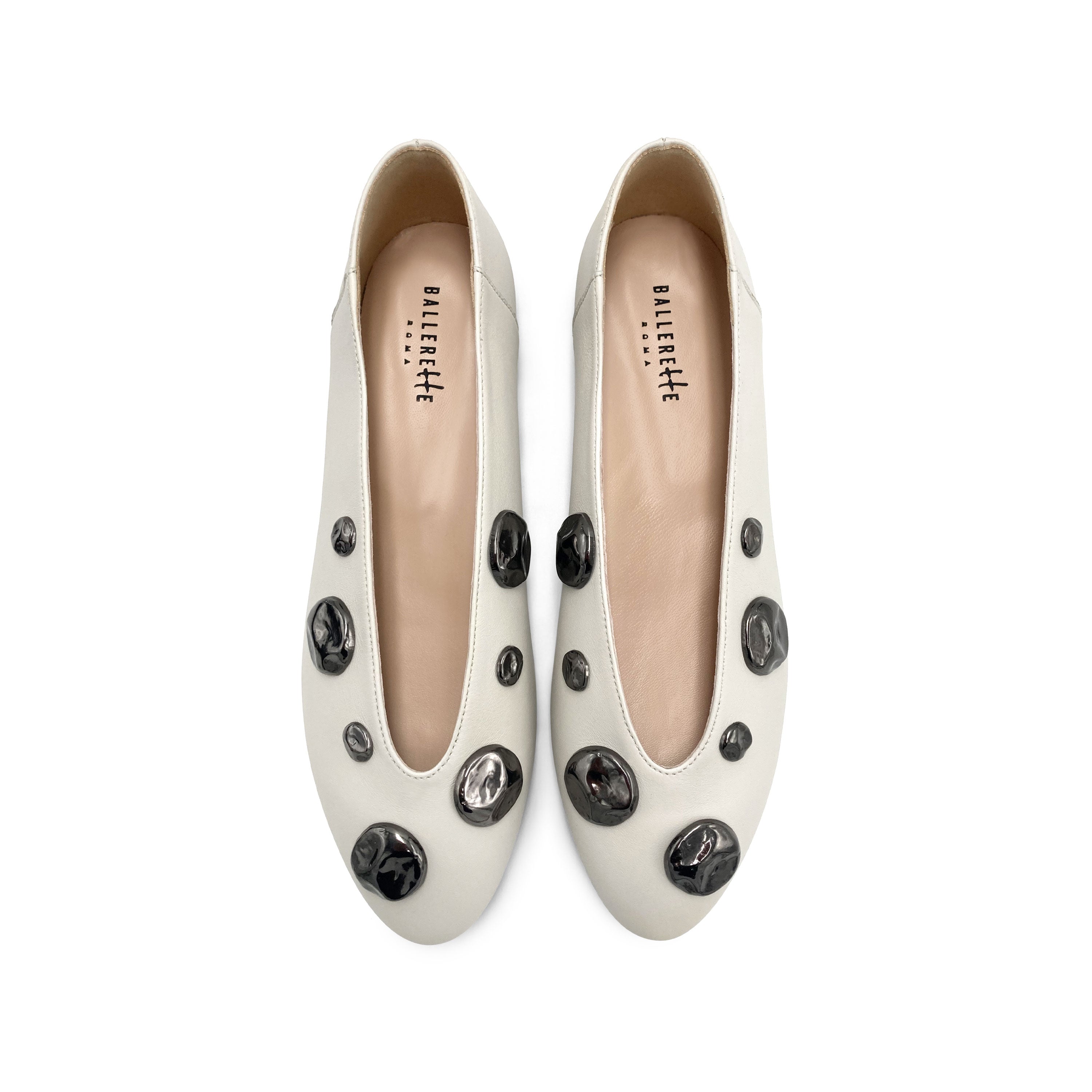 Ivory white leather ballet flats with V-cut and iron studs