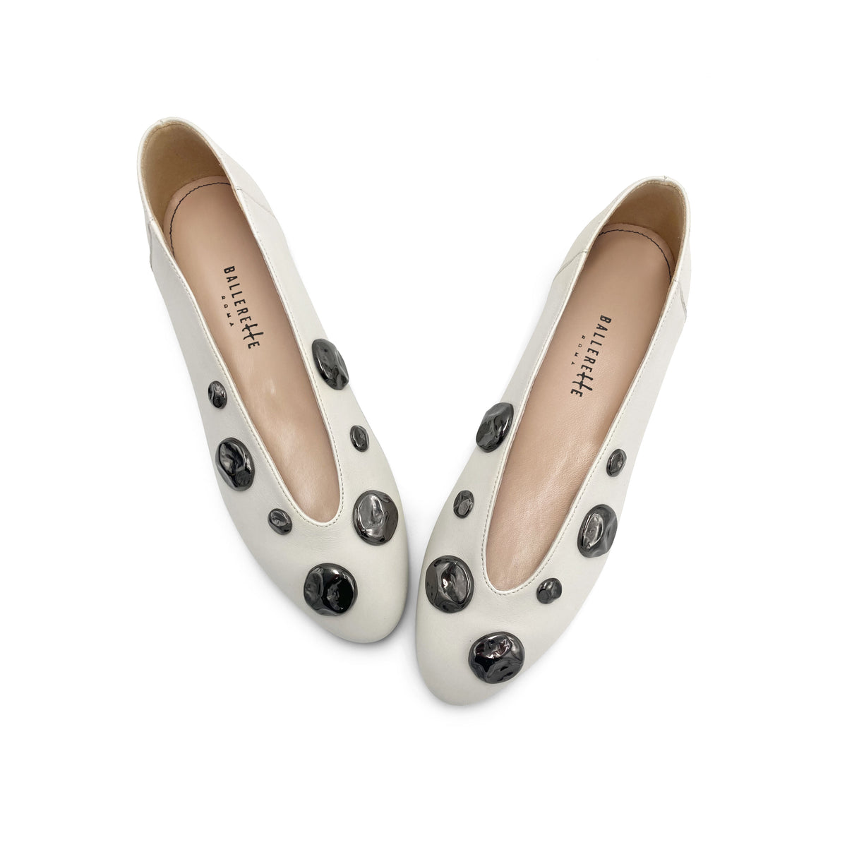 Ivory white leather ballet flats with V-cut and iron studs