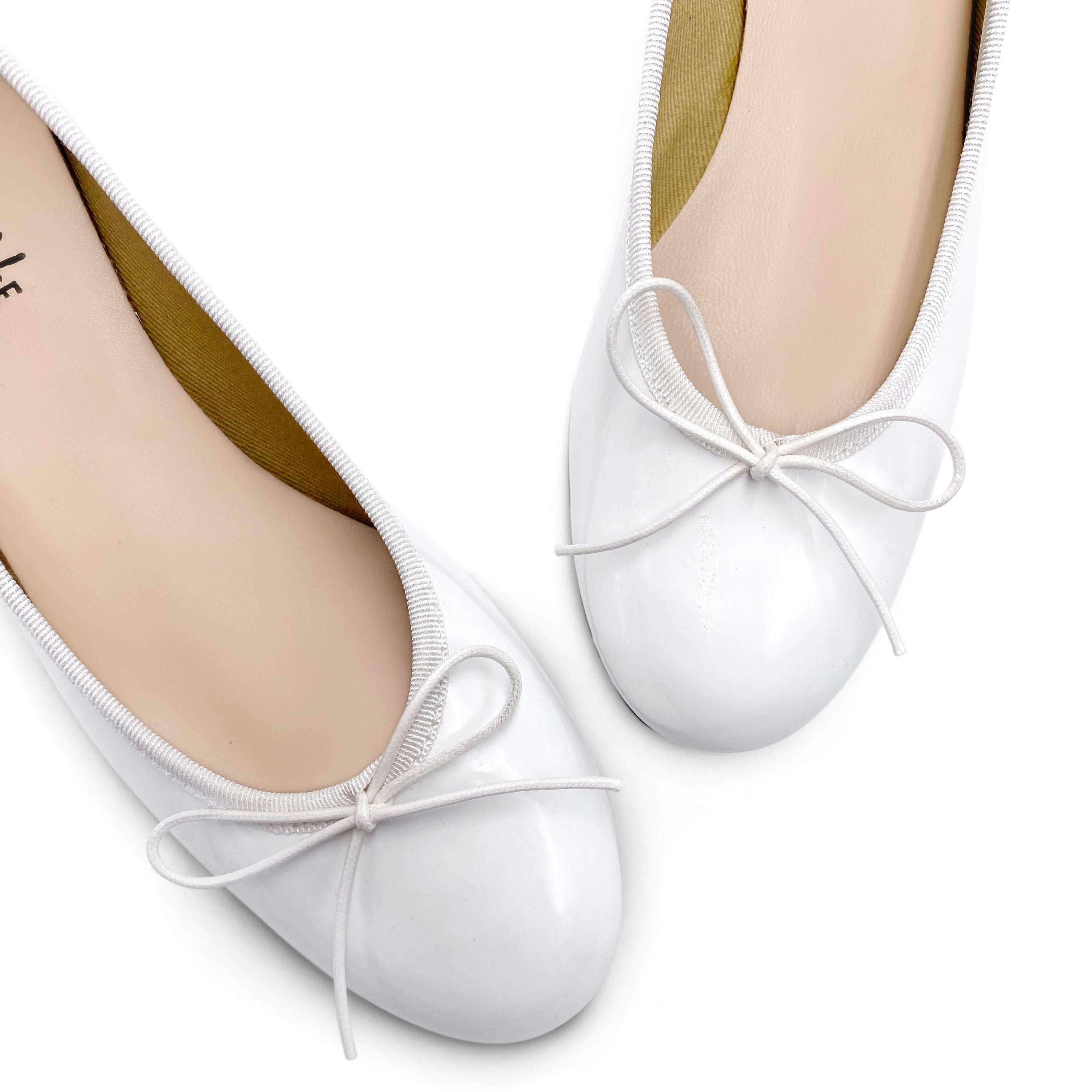 White patent ballerinas with high heels