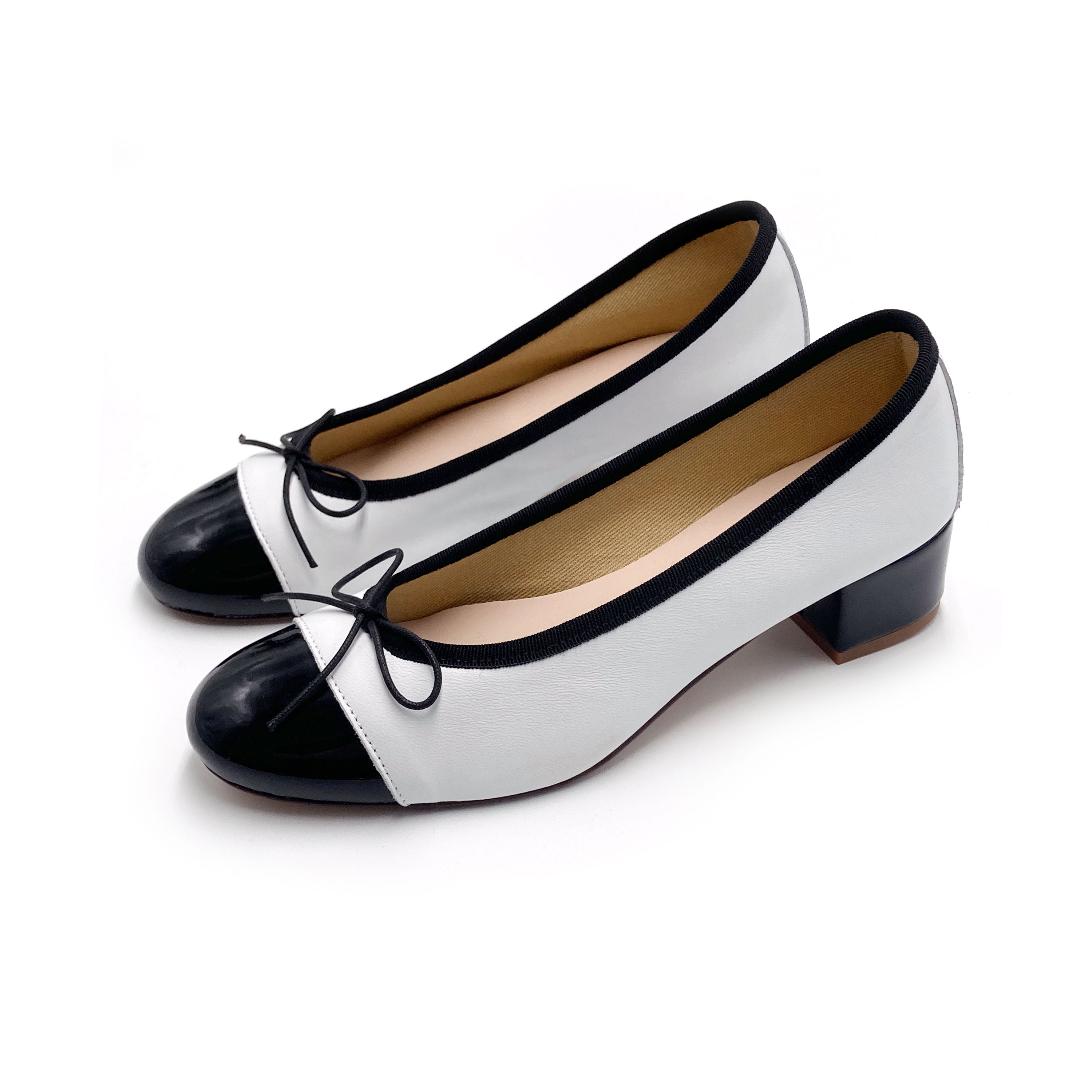 White leather ballet flats with high heel and patent toe