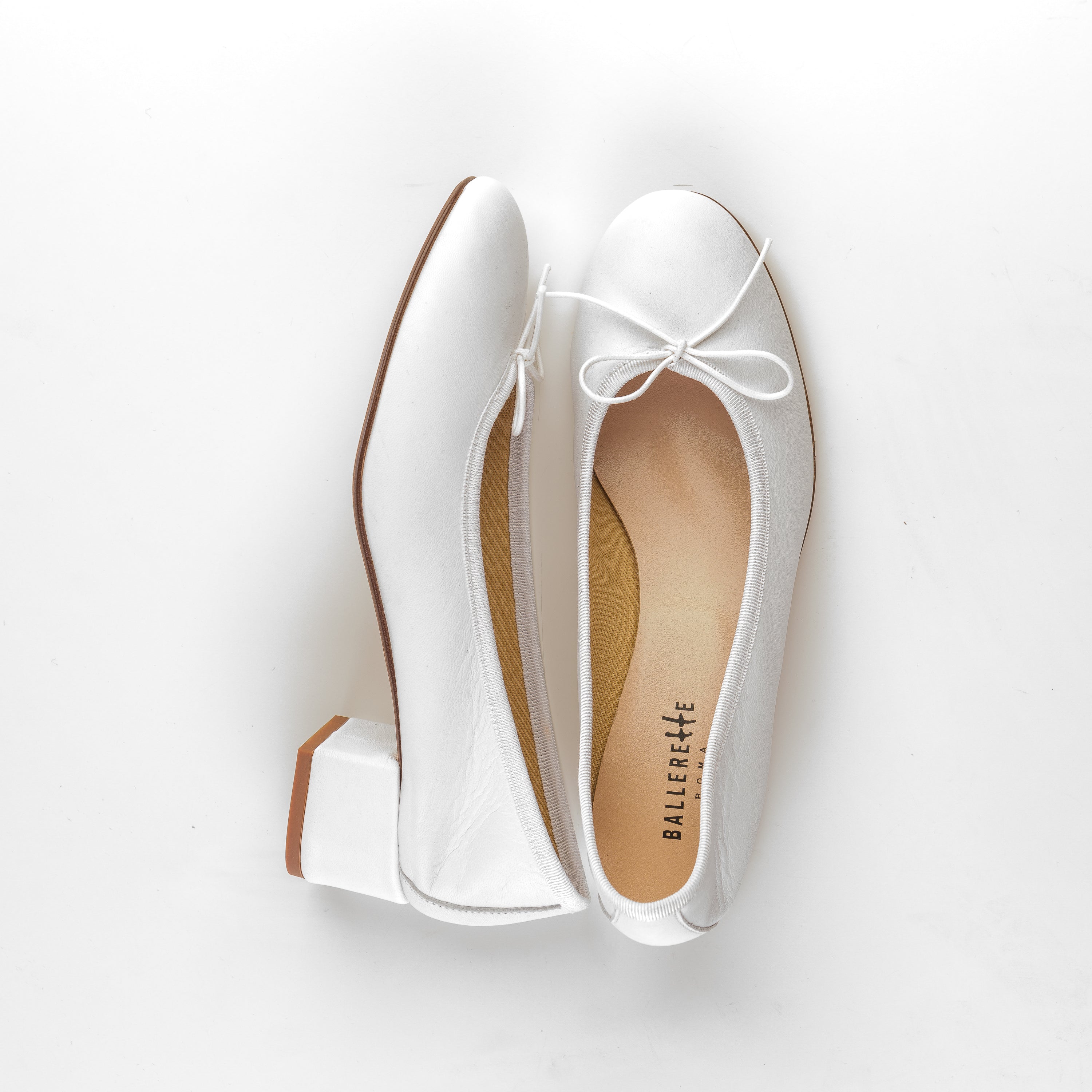 White leather ballet flats with heel