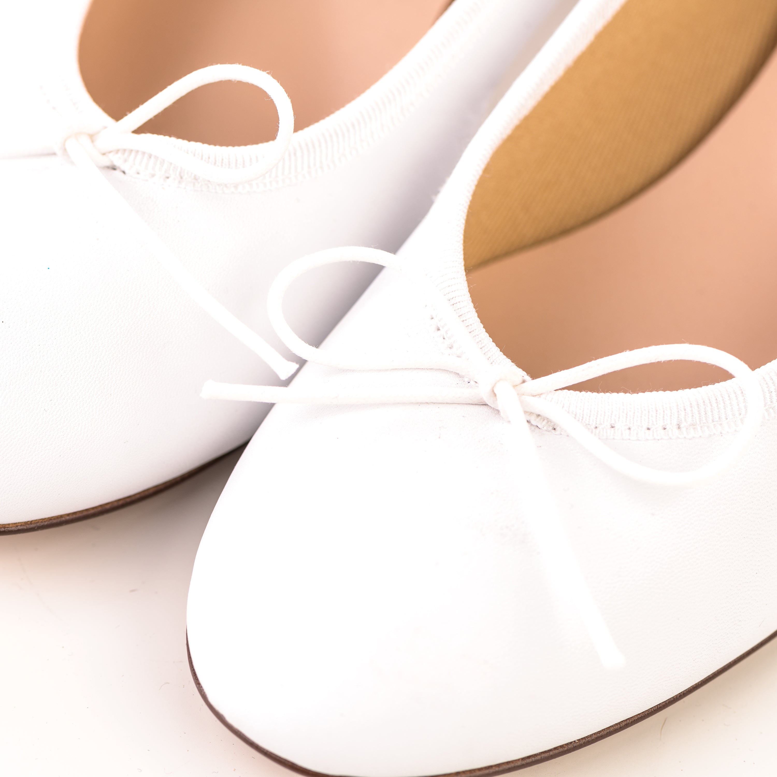 White leather ballet flats with heel