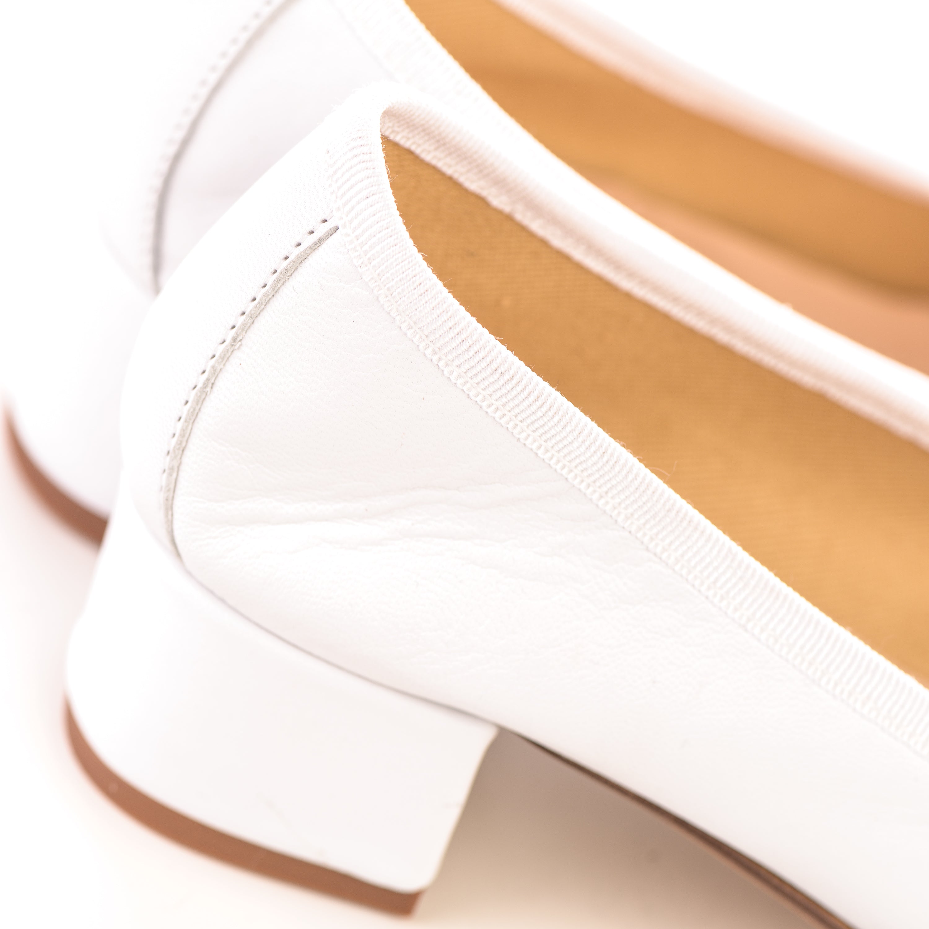 White leather ballet flats with heel