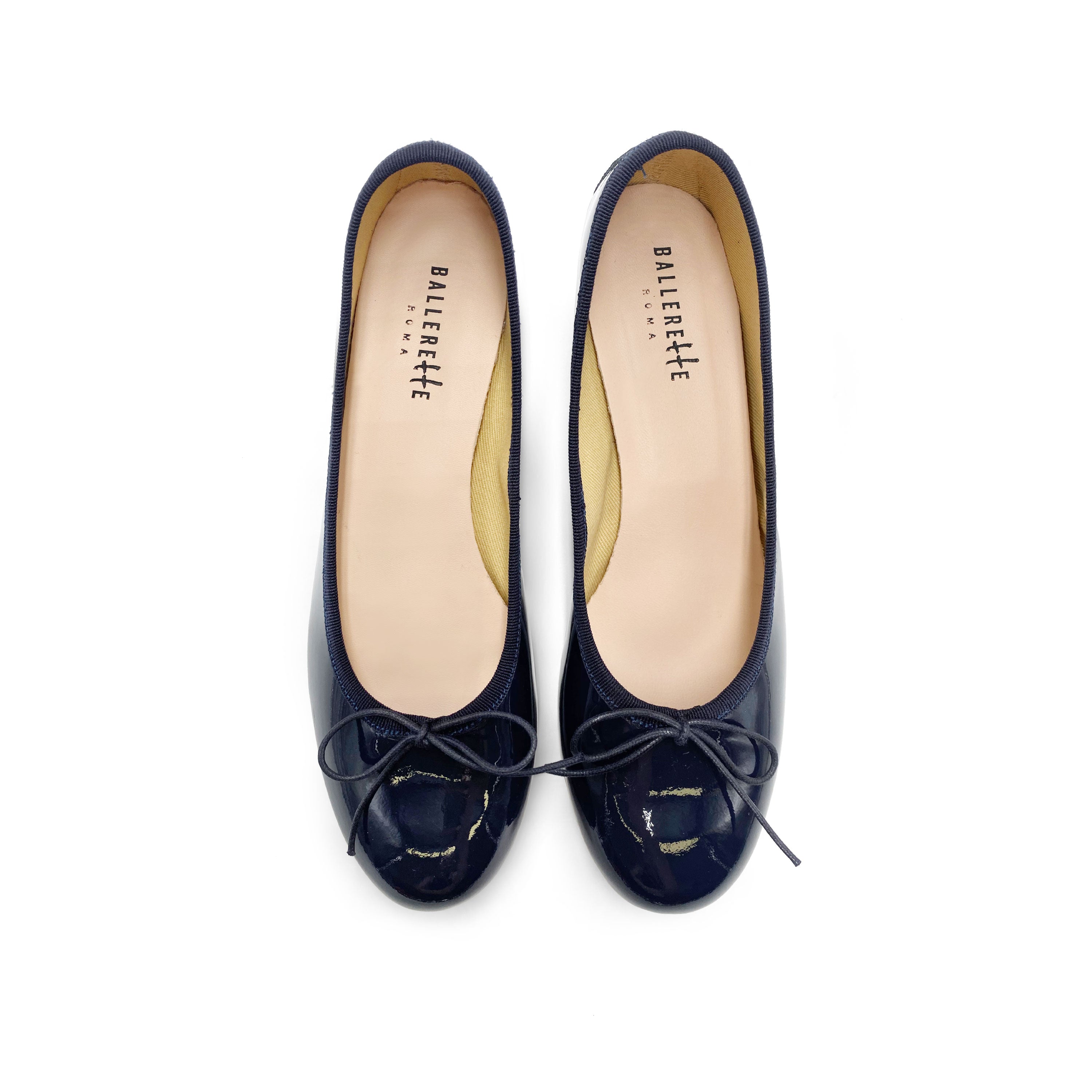 Blue patent leather ballet flats with heel