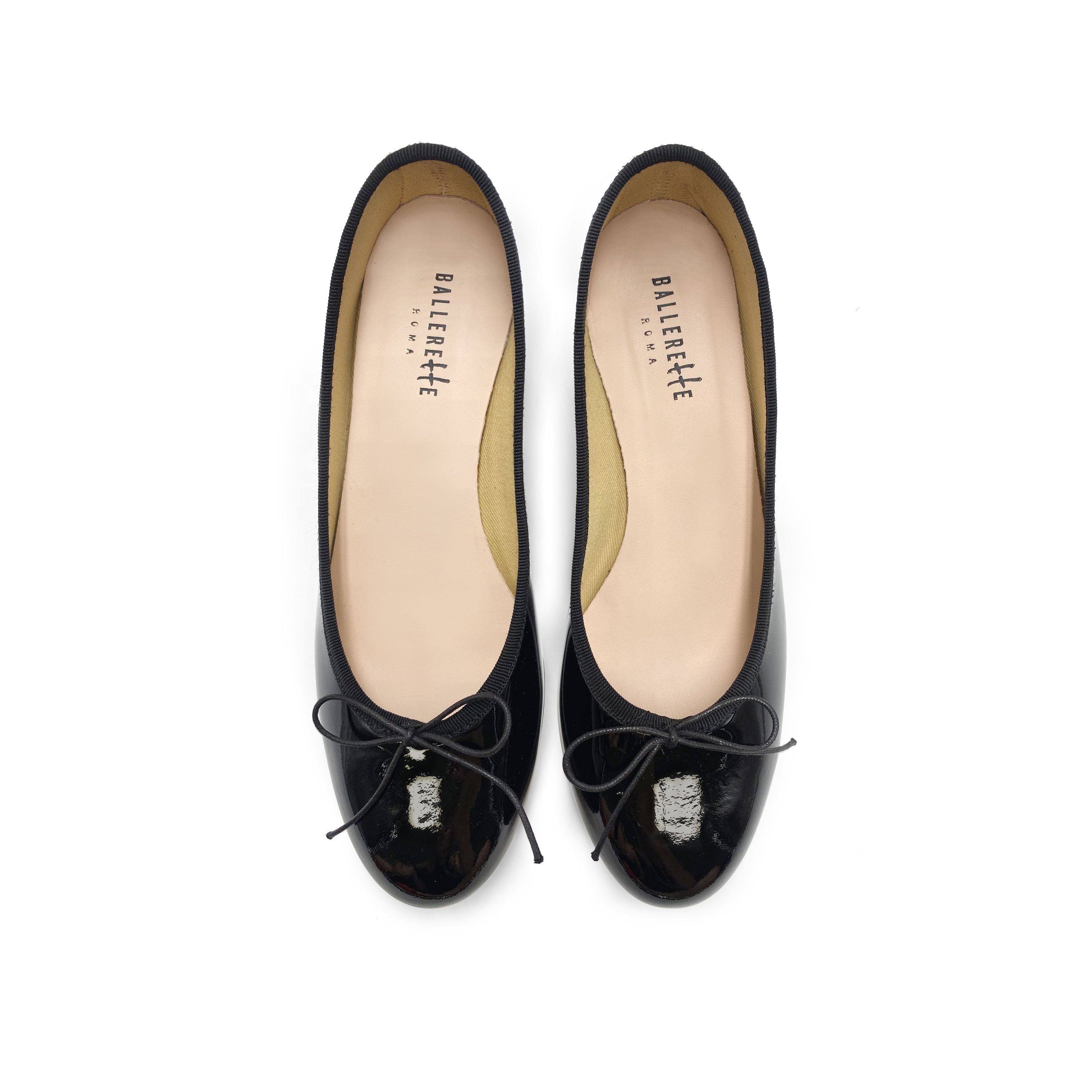 Black patent leather ballet flats with heel