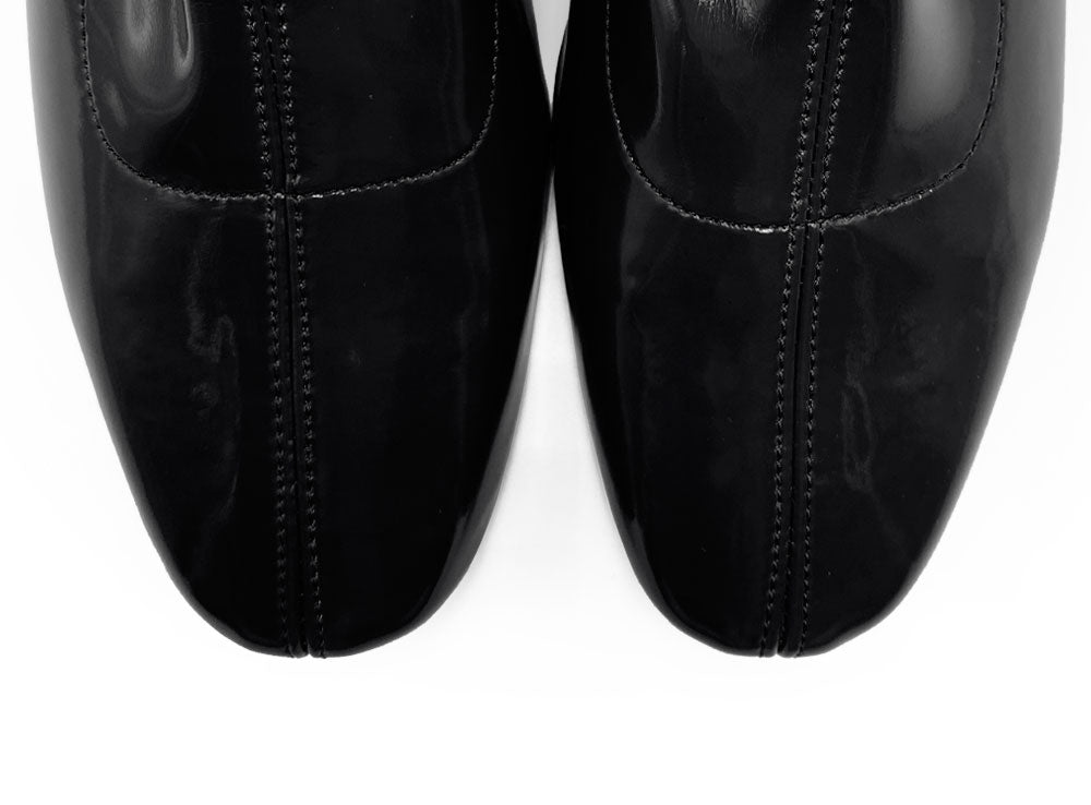 Black patent leather ankle boots with elasticated sock