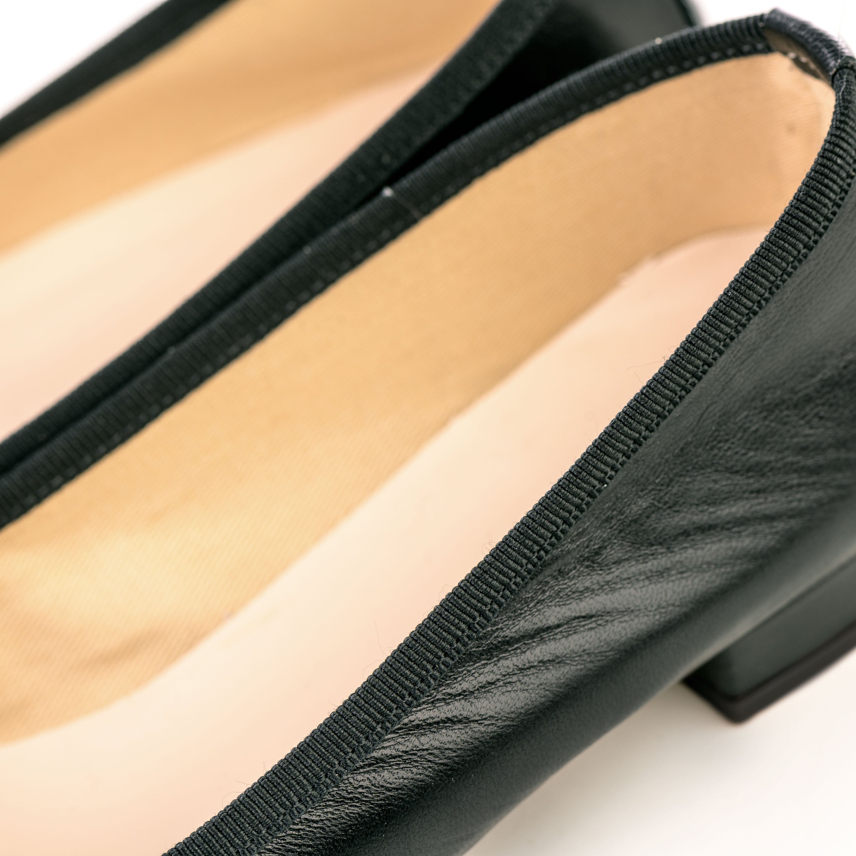 Pointed toe black leather ballet flats