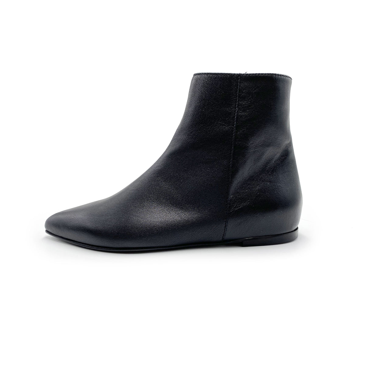 Black leather pointed-toe ankle boots with hidden internal platform