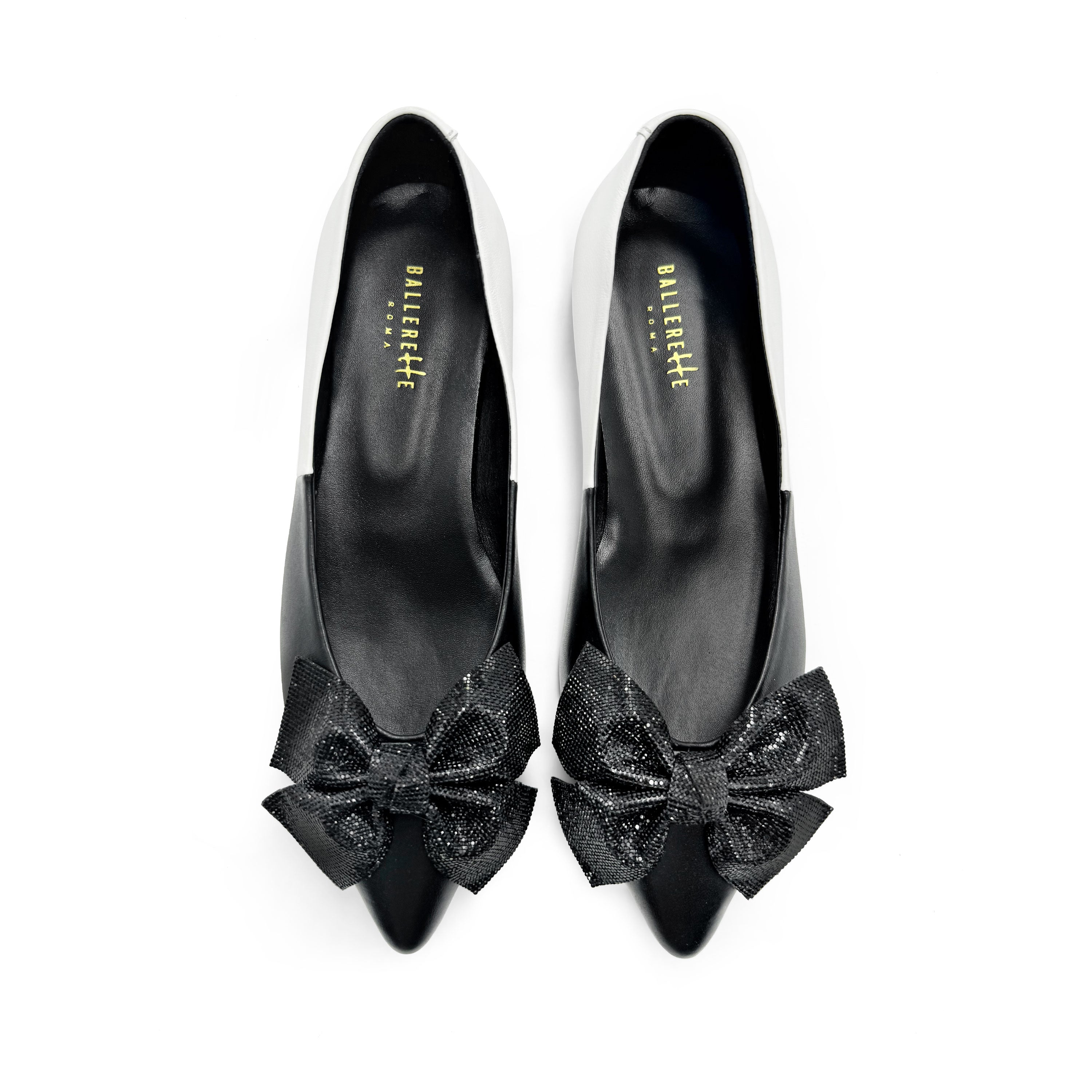 Black and white leather evening ballet flats with pointed toe and jewel bow