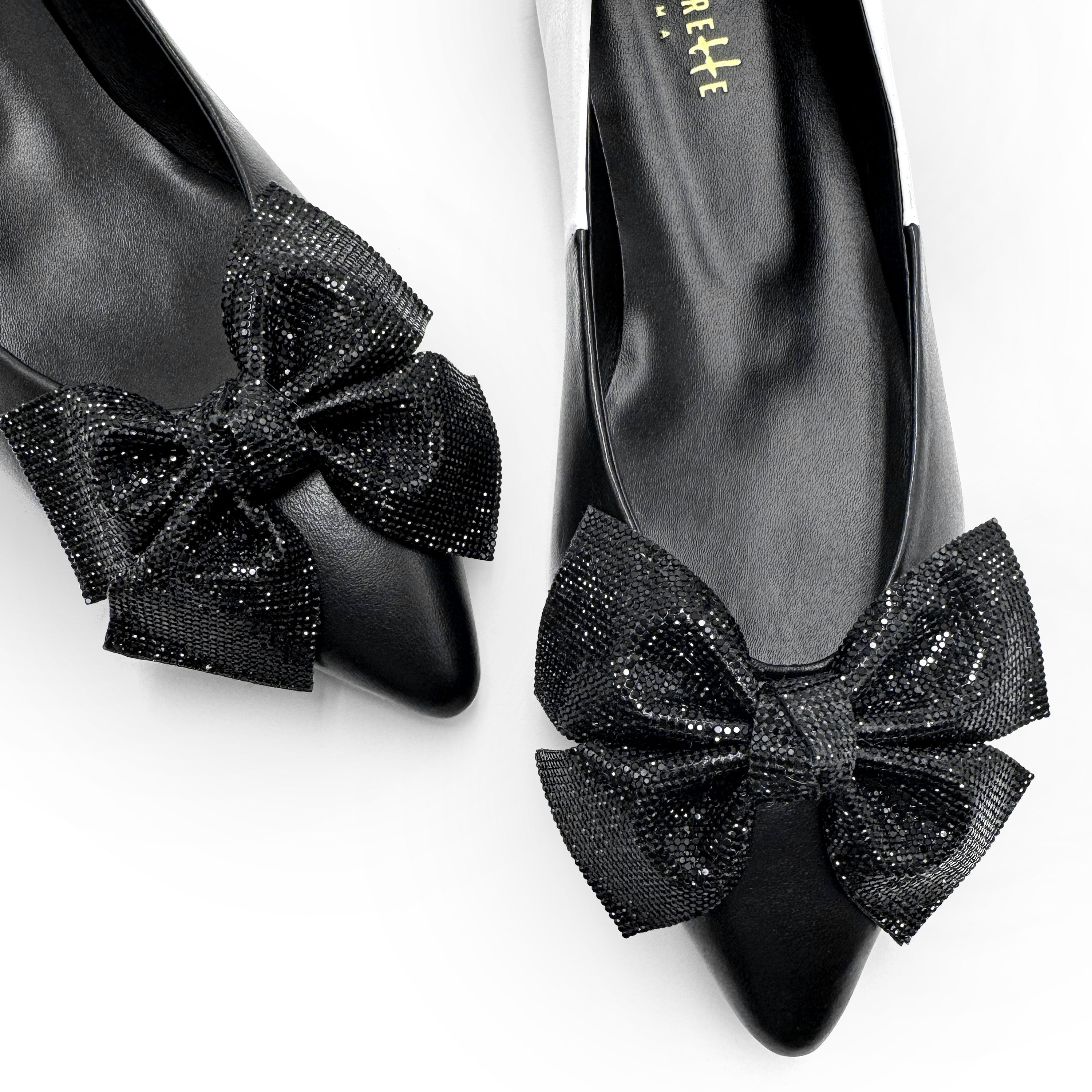 Black and white leather evening ballet flats with pointed toe and jewel bow