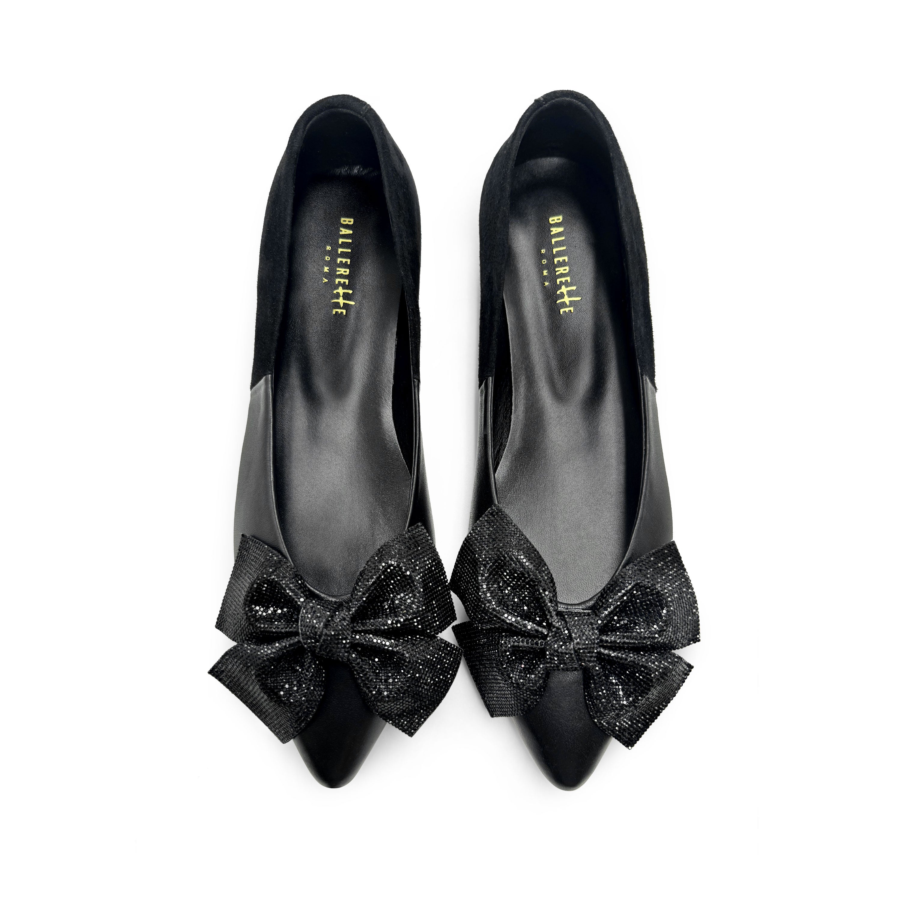 Black leather evening ballet flats with pointed toe and jewel bow