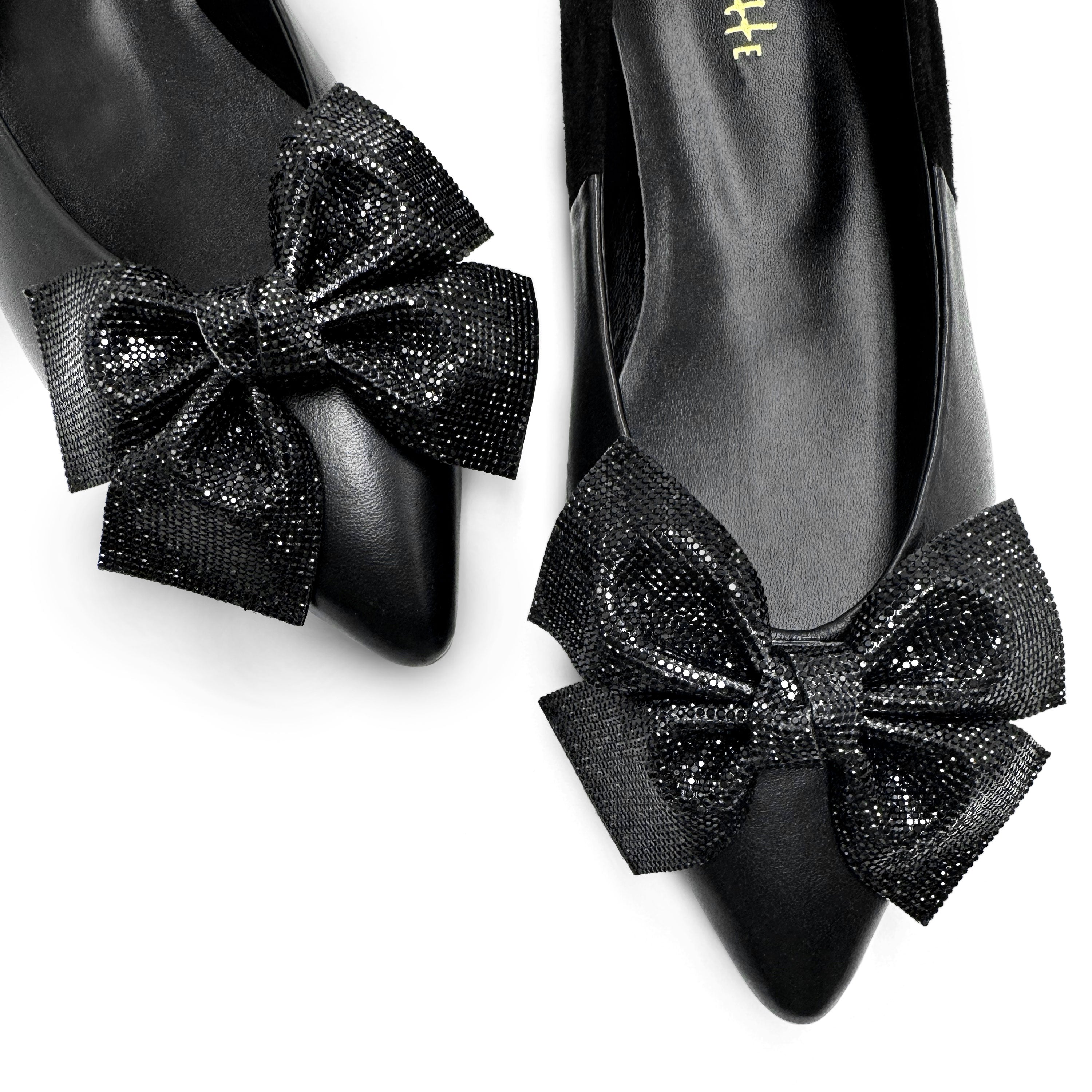 Black leather evening ballet flats with pointed toe and jewel bow