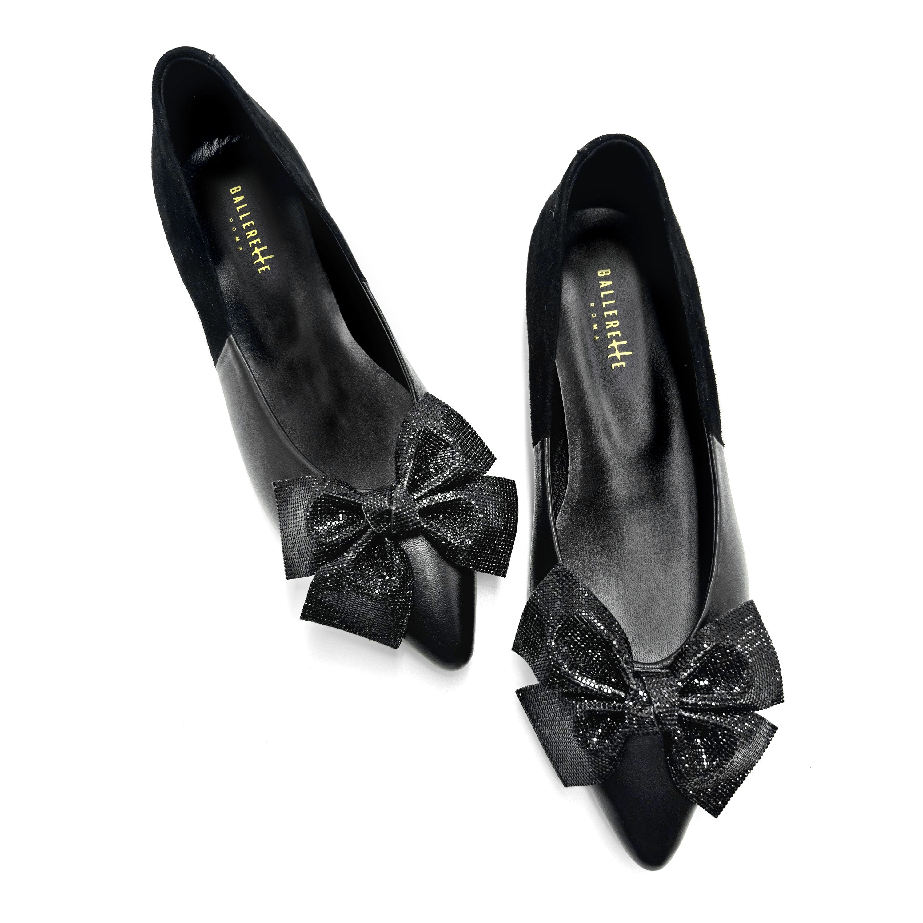 Black leather evening ballet flats with pointed toe and jewel bow