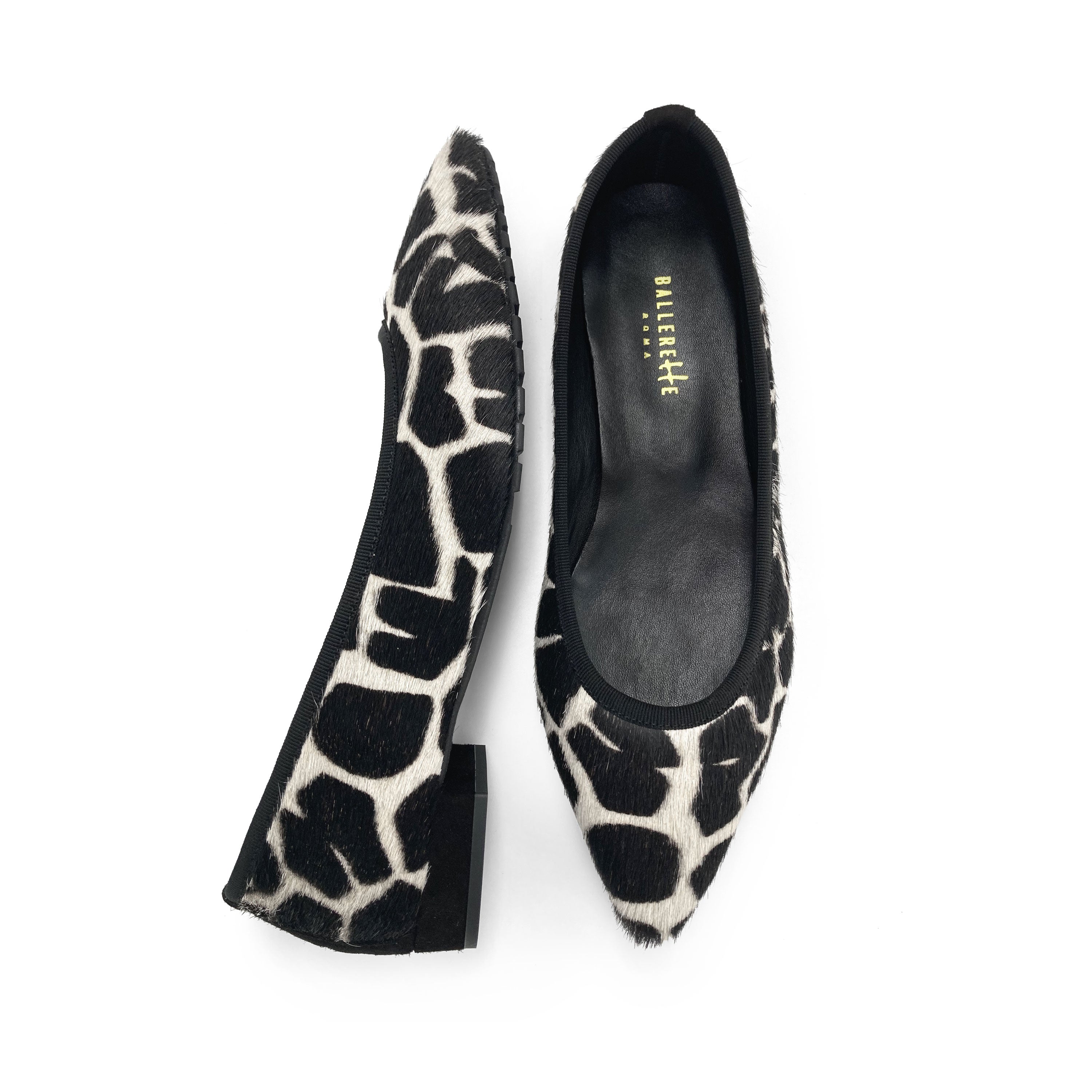 Black and white animal print pointed ballet flats