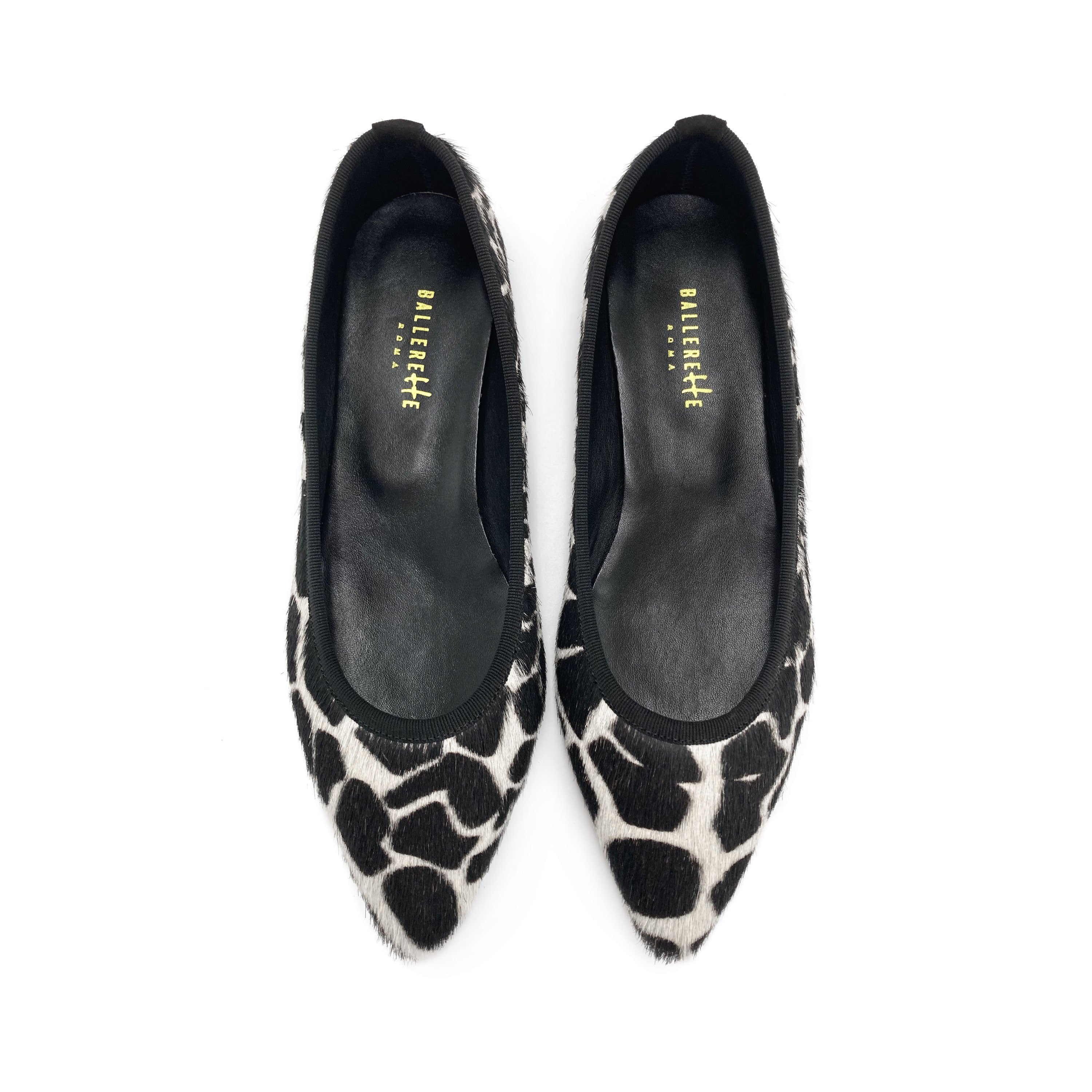 Black and white animal print pointed ballet flats