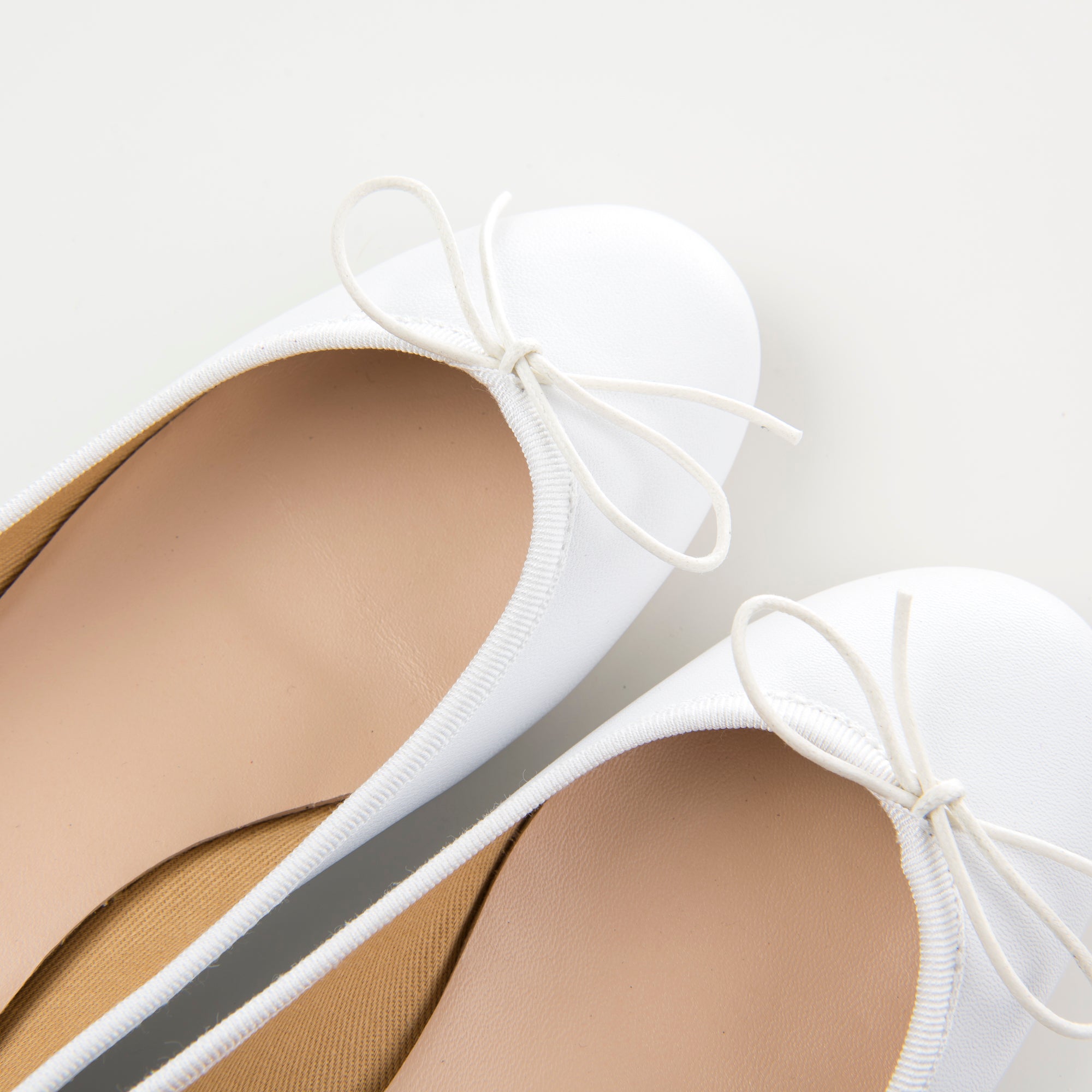 White leather ballet flats