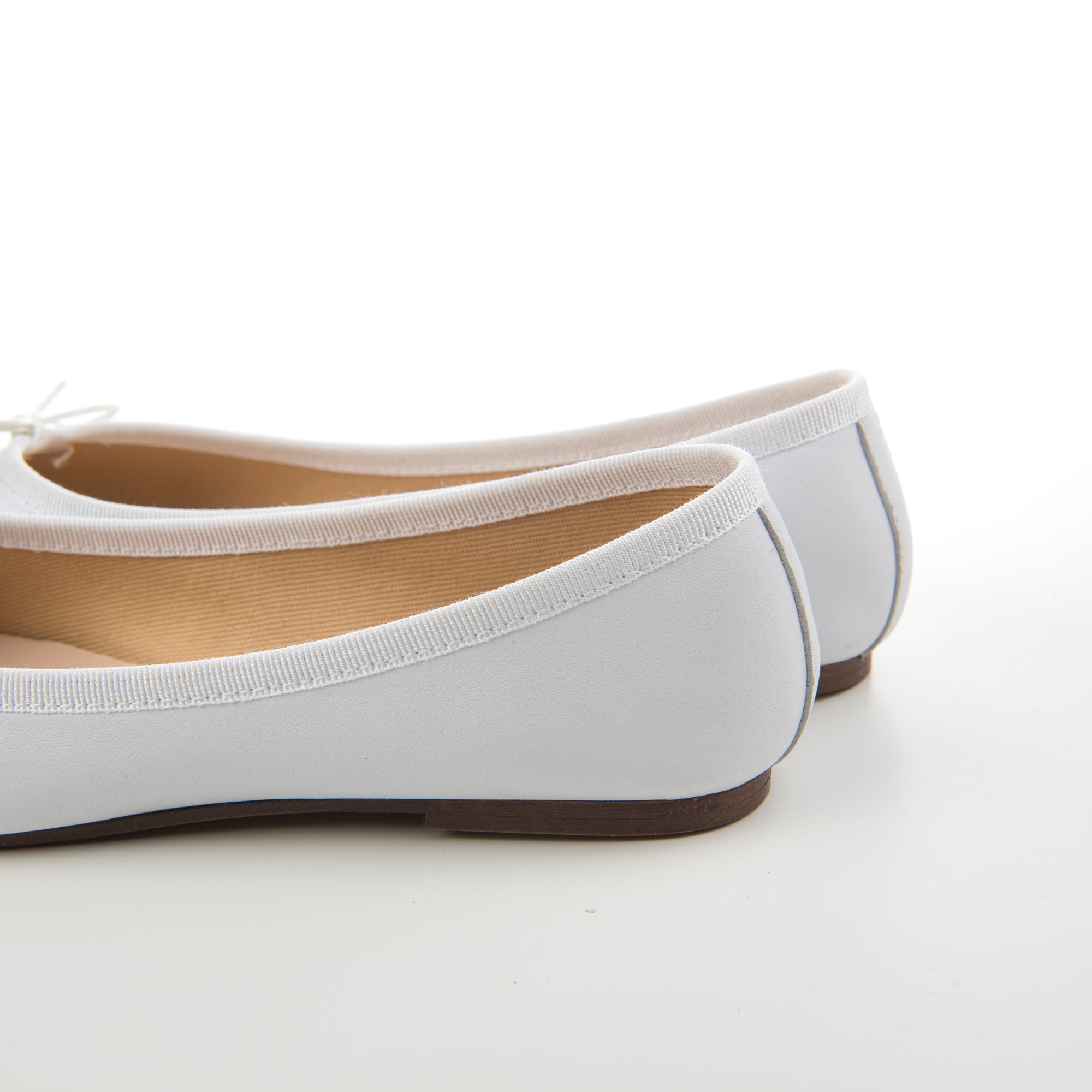 White leather ballet flats