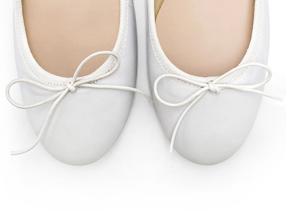 White leather ballet flats