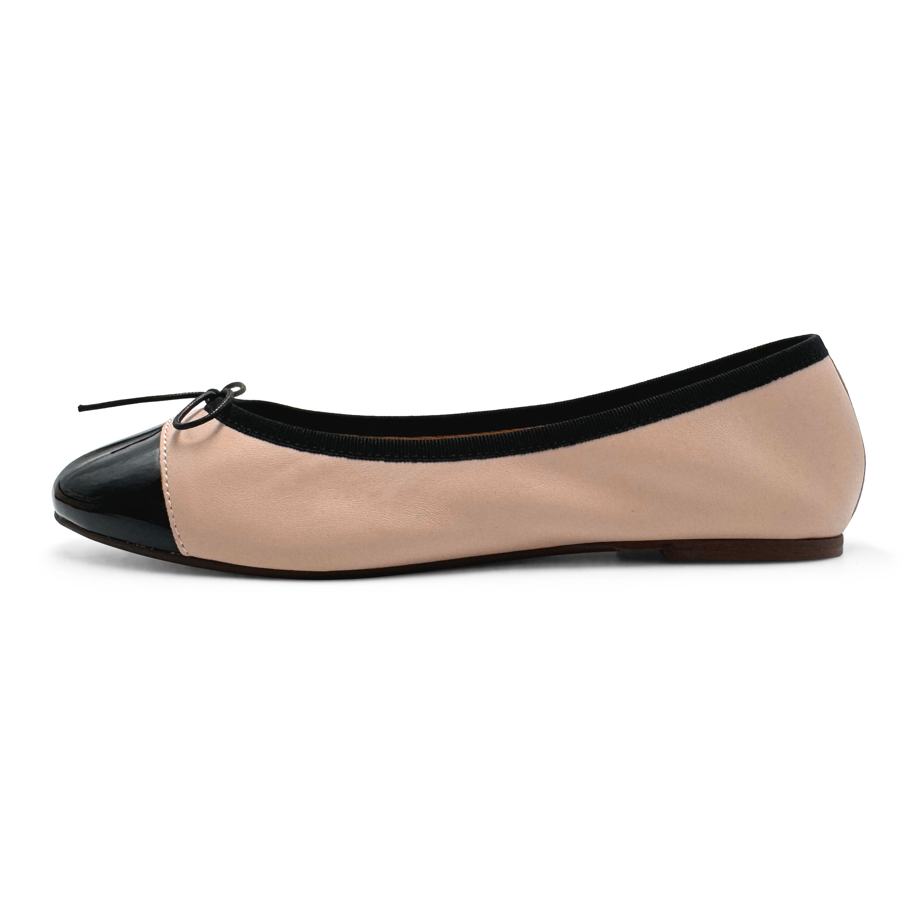 Blush pink leather ballet flats with black patent toe