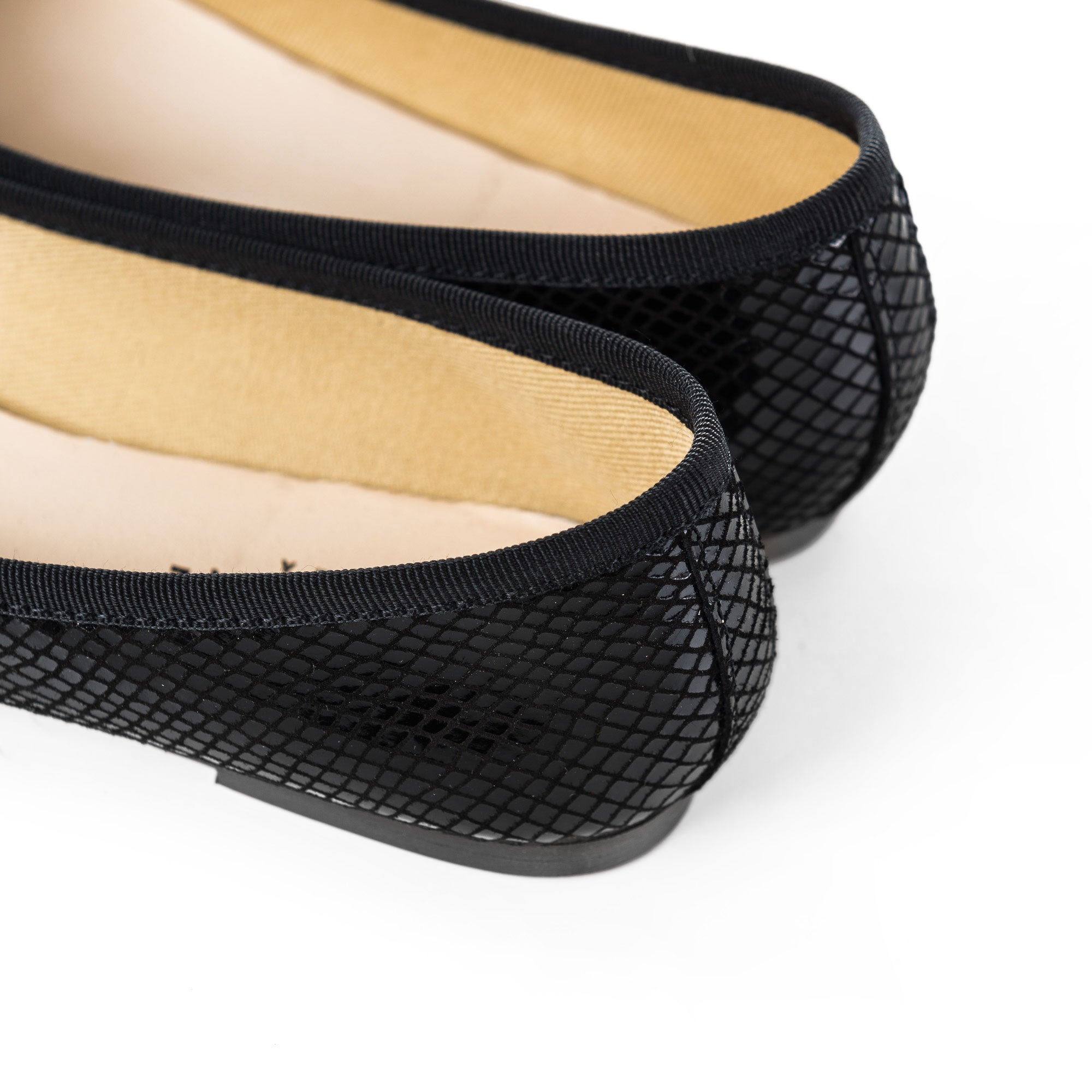 Black laminated suede ballet flats