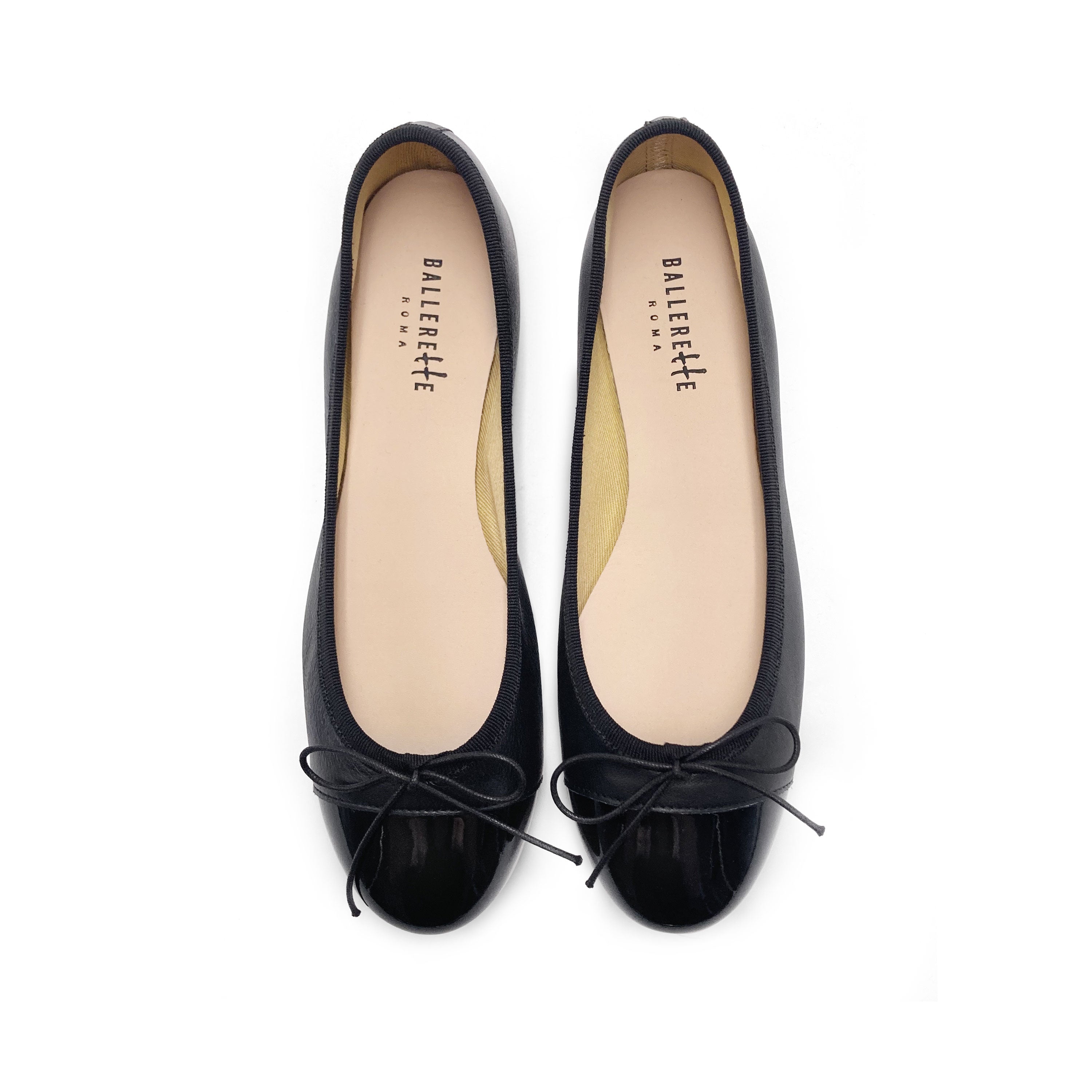 Black leather ballet flats with black patent toe