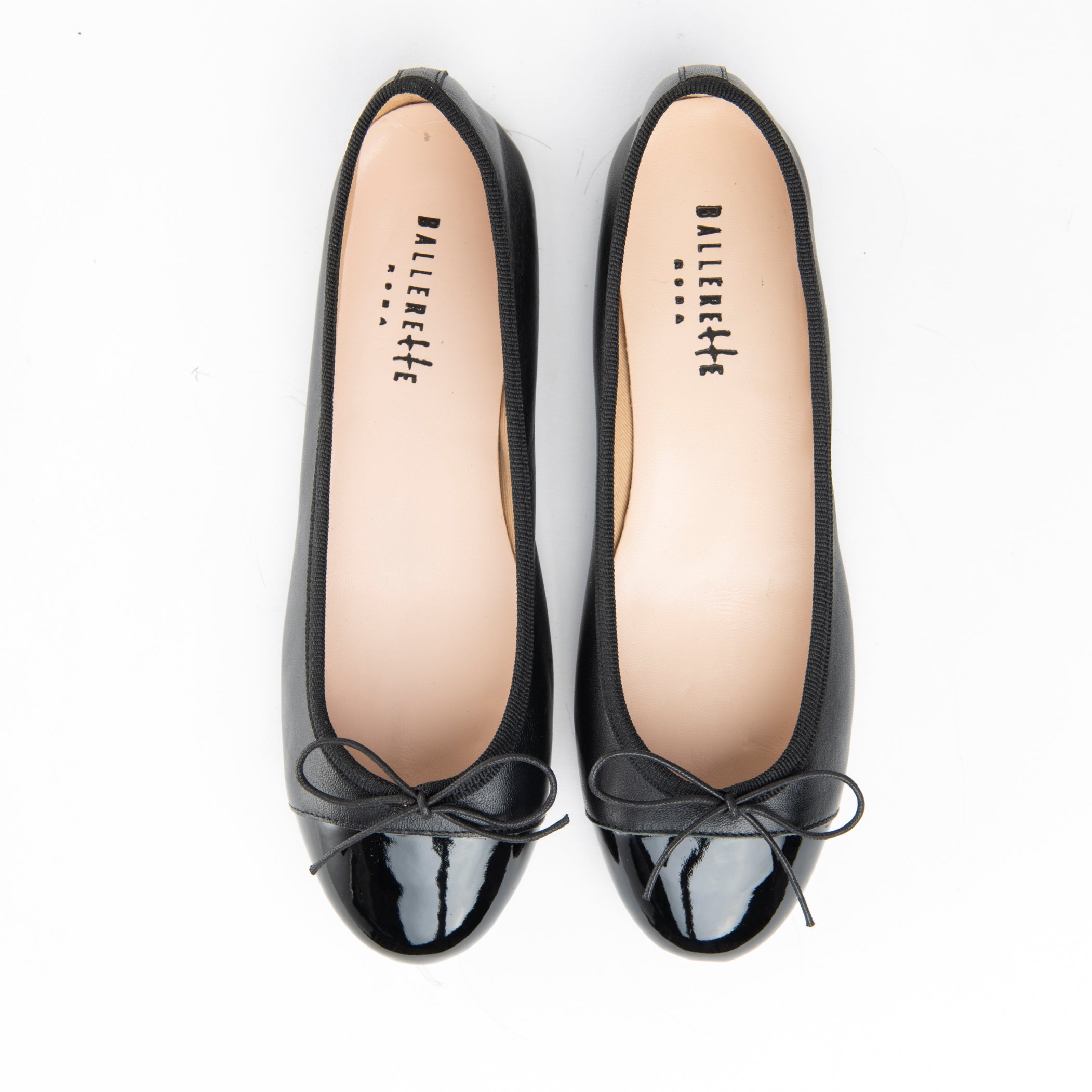 Black leather ballet flats with black patent toe