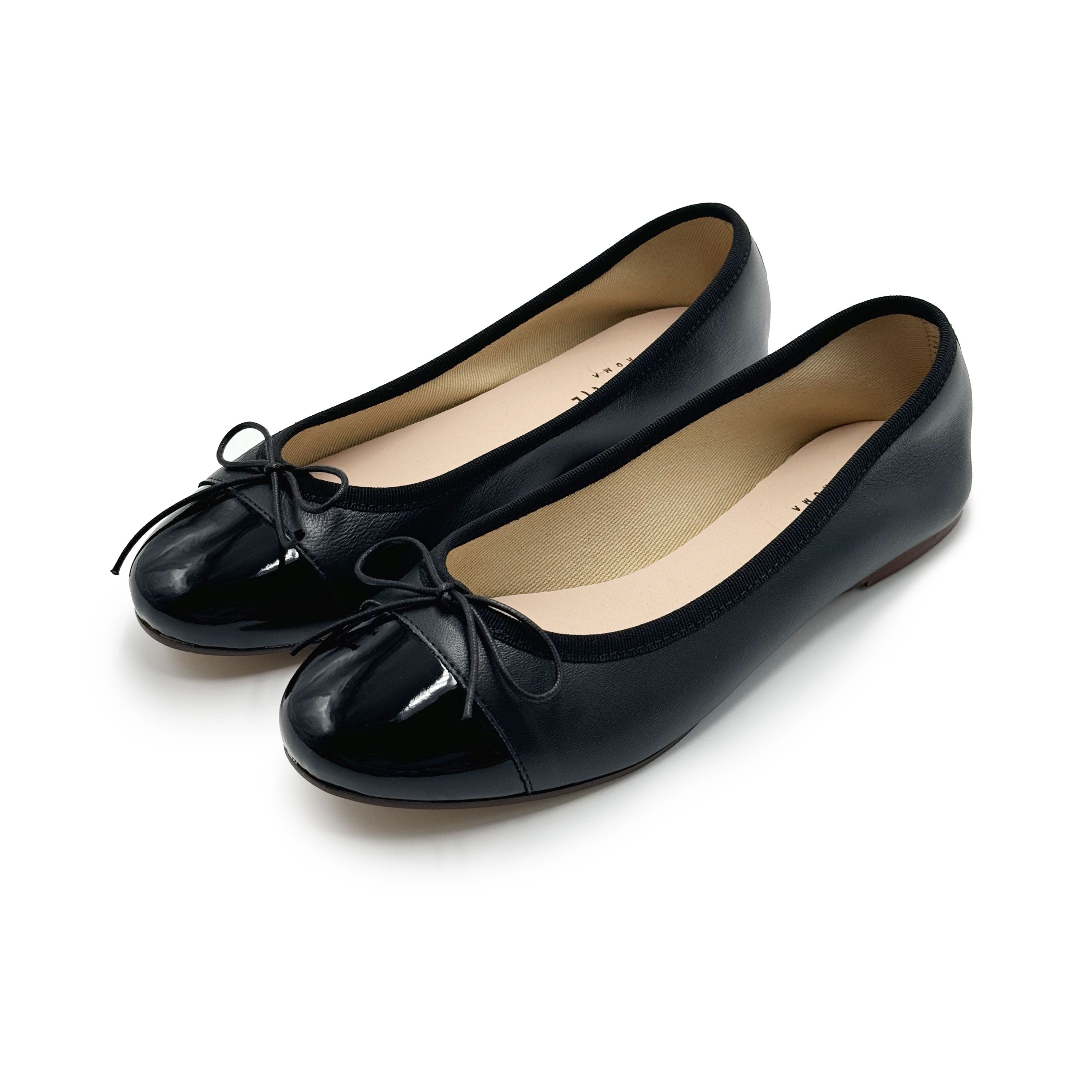 Black leather ballet flats with black patent toe