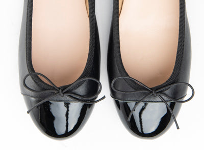 Black leather ballet flats with black patent toe