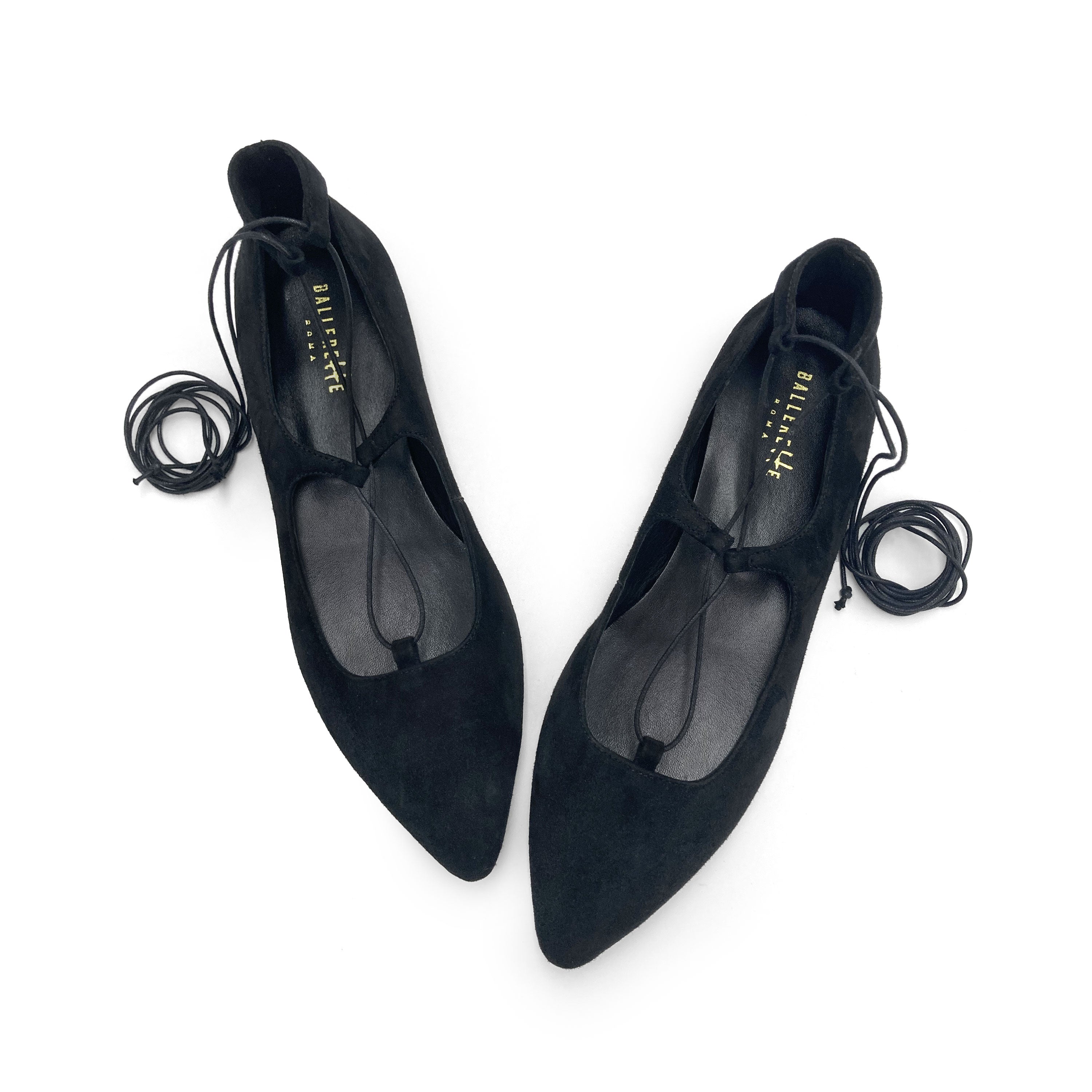 Black suede ballet flats with straps