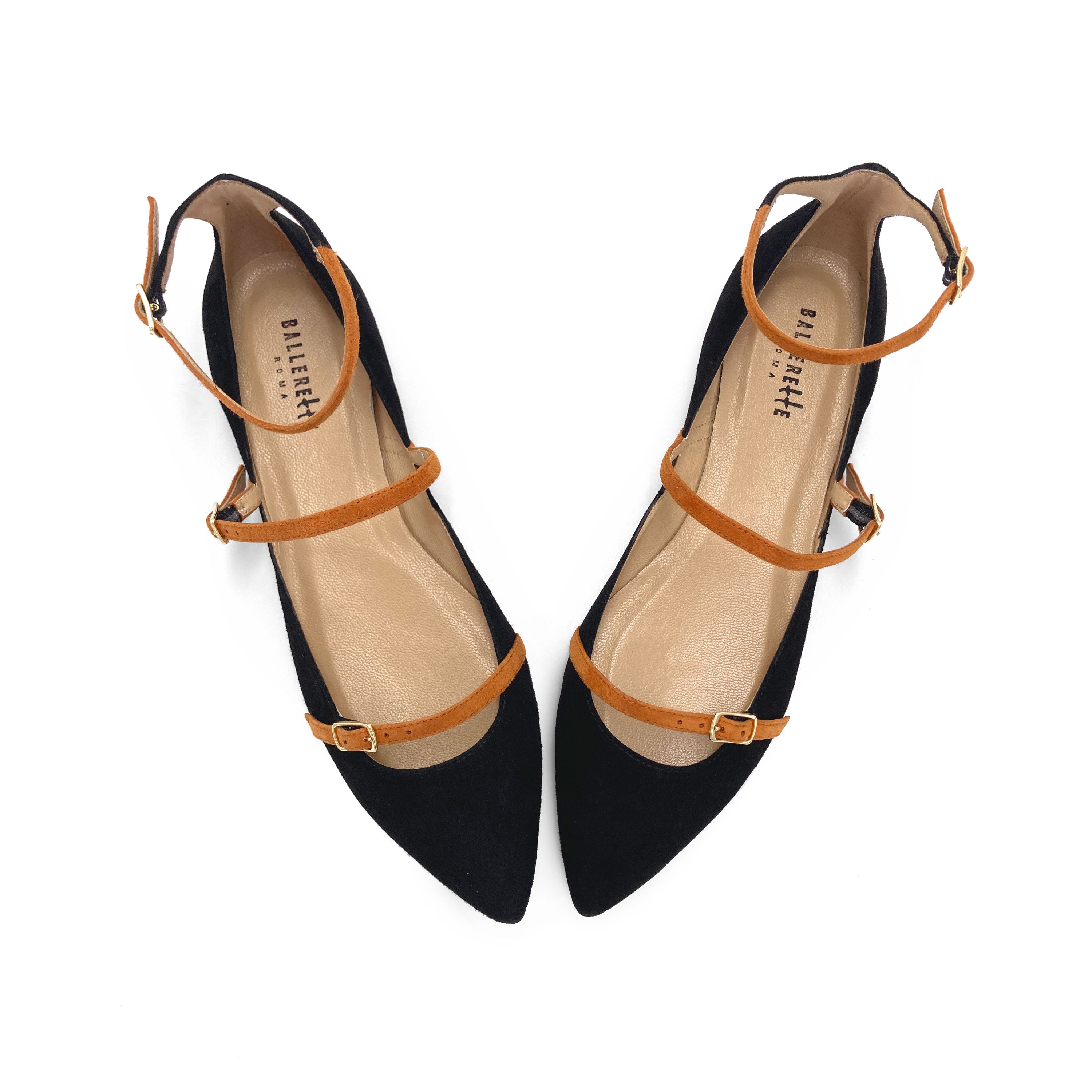 Black suede pointed ballet flats with biscuit-colored straps