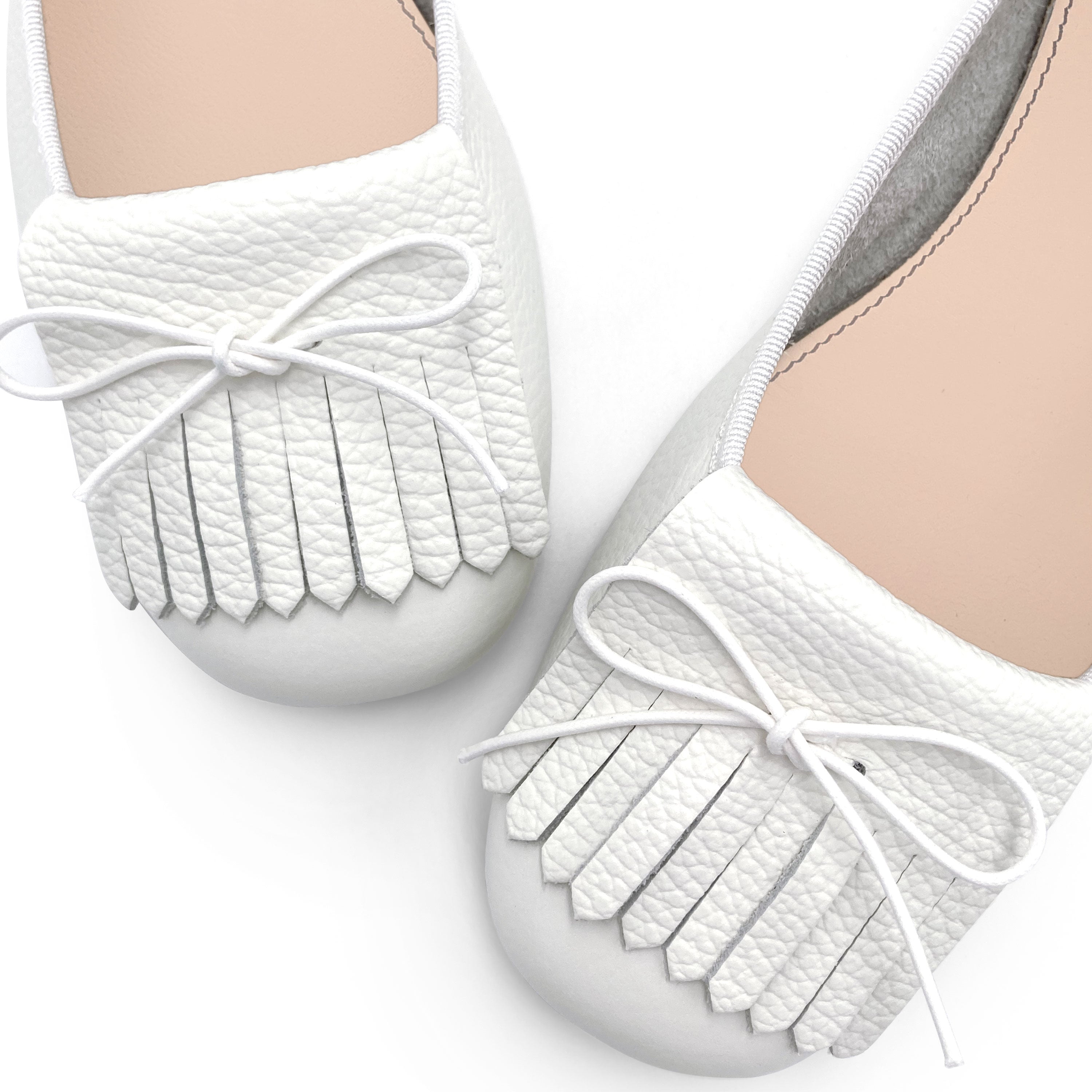 White leather moccasins with fringe